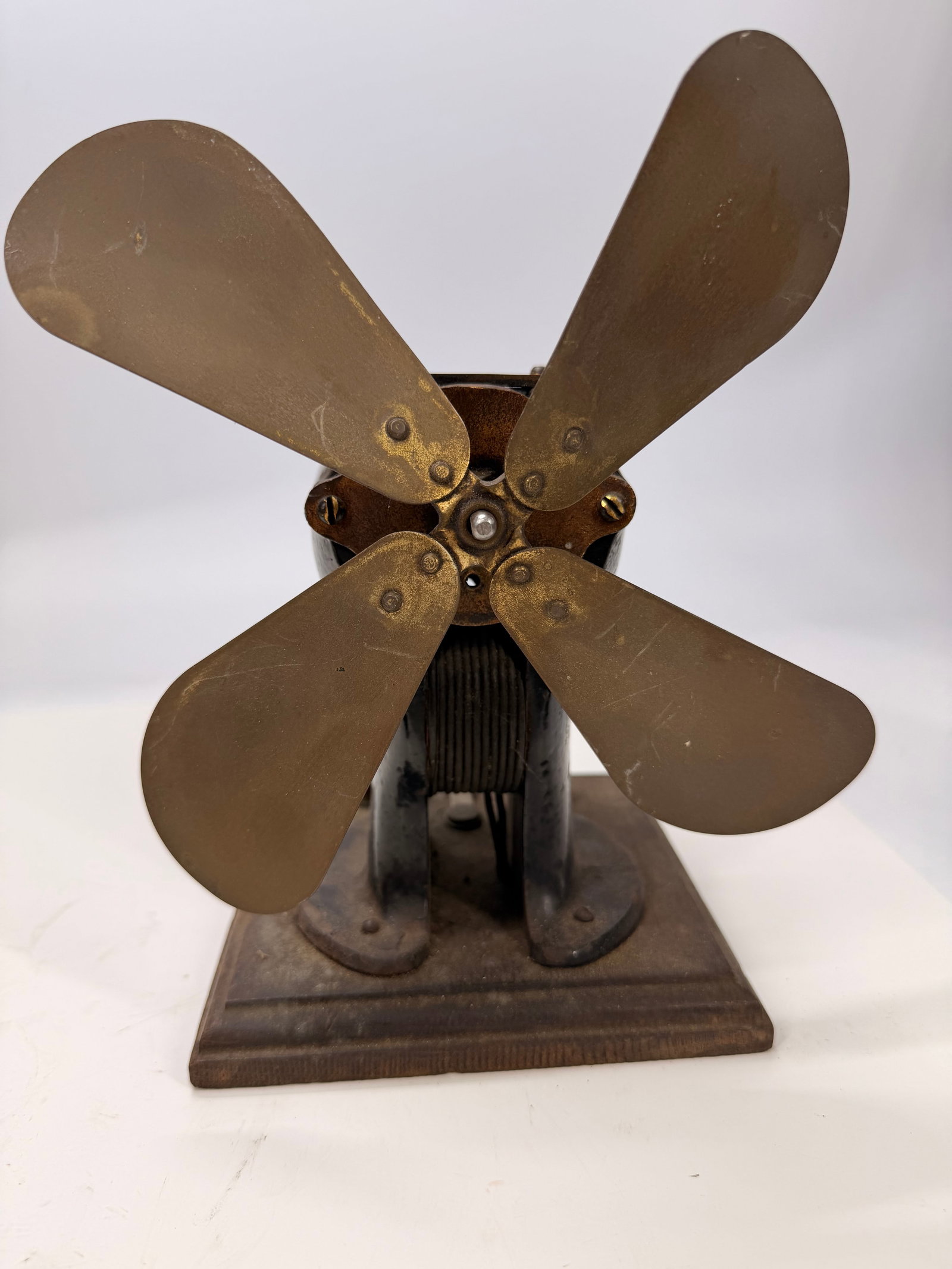 Antique Manhattan No. 3 Brass Blade Electric Fan Motor: Antique Manhattan No. 3 electric fan motor with original four brass blades, cast iron housing, and cast iron base. Manufactured in the early 20th century, this motor is a desirable example of early Am