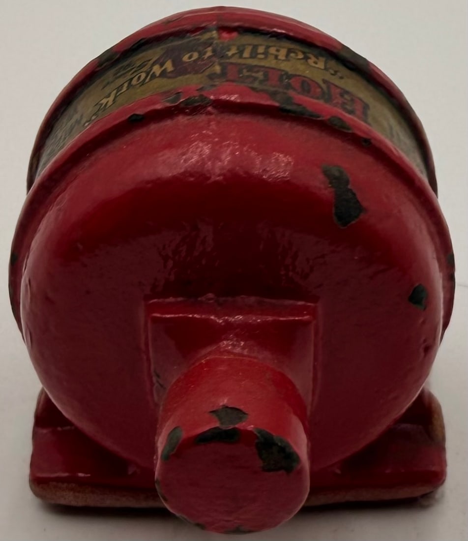 Holt Motor Service Cast Iron Paperweight: This vintage cast iron advertising paperweight is modeled after a miniature electric motor and promotes Holt Motor Service of Milwaukee, Wisconsin. Finished in its original red paint, it features the 