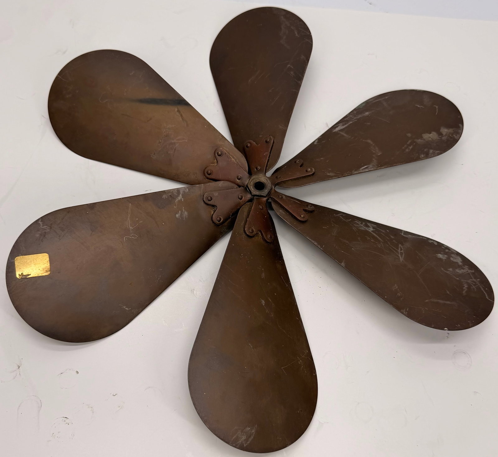 Vintage Brass 6 Wing Fan Blade Assembly: This vintage 6-blade brass fan blade assembly is an original replacement component from an early 20th-century electric fan. It measures approximately 16 inches in overall diameter, with each individua