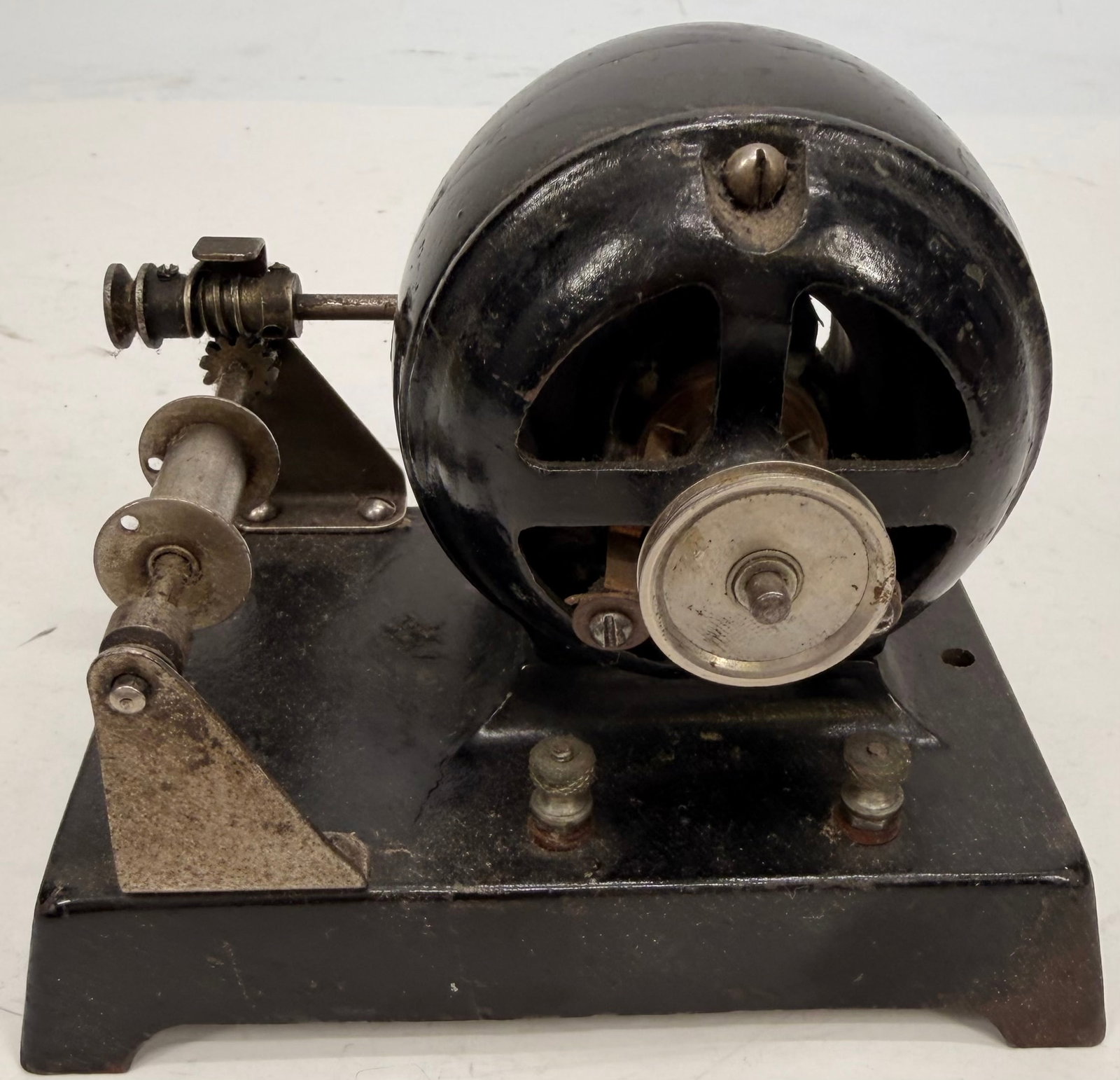 Antique Knapp Leader Toy Electric Motor: This antique Knapp Leader toy electric motor dates to the early 1900s and was designed to power small toys, mechanical models, and other hobby accessories. It features a heavy cast iron housing with a