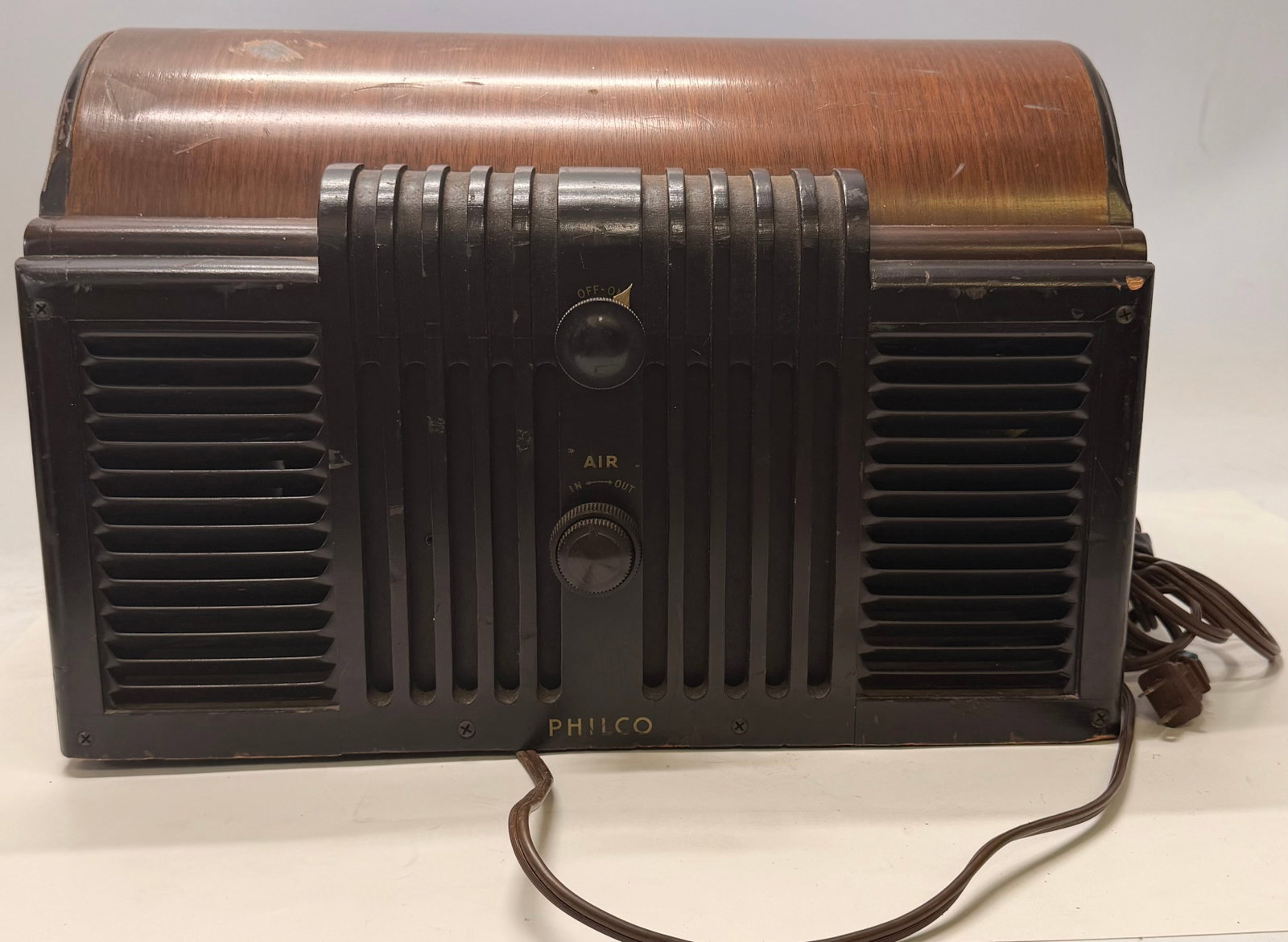 Vintage Philco Window Ventilator Fan: This vintage Philco Window Ventilator Fan dates to the early 1940s and features a handsome walnut cabinet styled to resemble a tabletop radio of the period. Designed to fit in a window opening, it cou