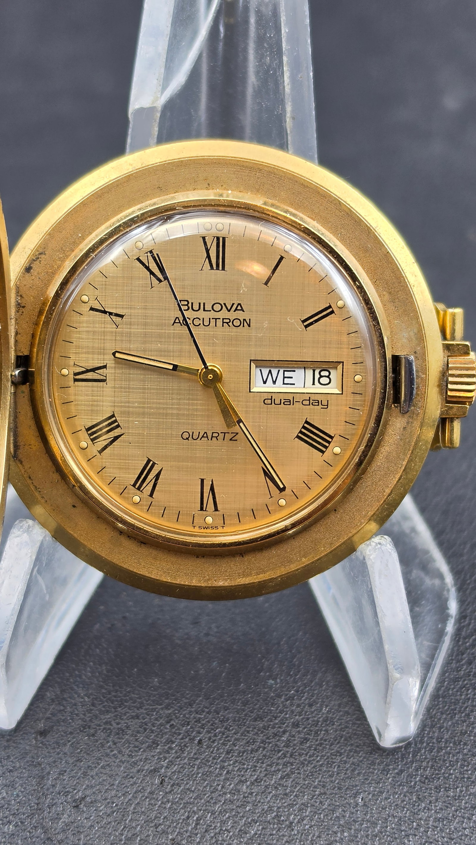 Bulova Accutron Dual-Day Quartz Pendant Pocket Watch, Gold-Tone, Circa 1978: This is a Bulova Accutron "dual-day" quartz pocket watch, case diameter 42.50mm (measured), gold-tone base metal case with a monogram "RPW" engraved on the case back. The dial is signed "Bulova Accutr
