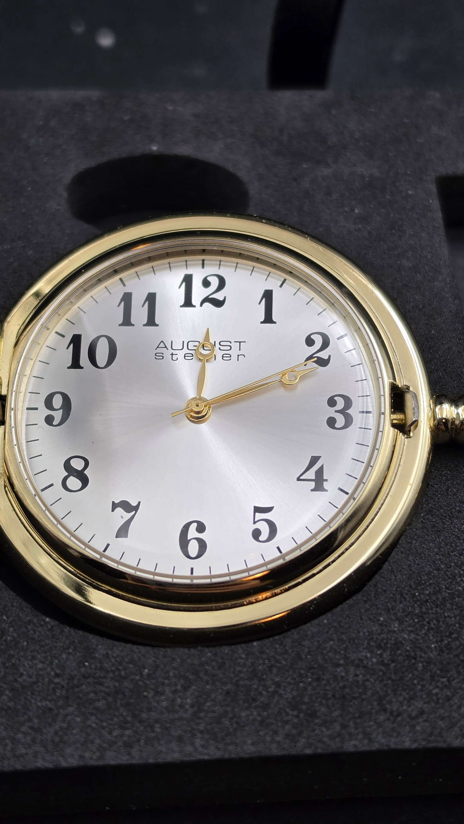 August Steiner Train Motif Two-Tone Pocket Watch and Money Clip Set, Quartz, Gold Chain, Original Bo: This is an August Steiner quartz pocket watch and matching money clip gift set. The cover features a two-tone engraved locomotive train scene in gold-tone and silver-tone finish, framed by a decorativ