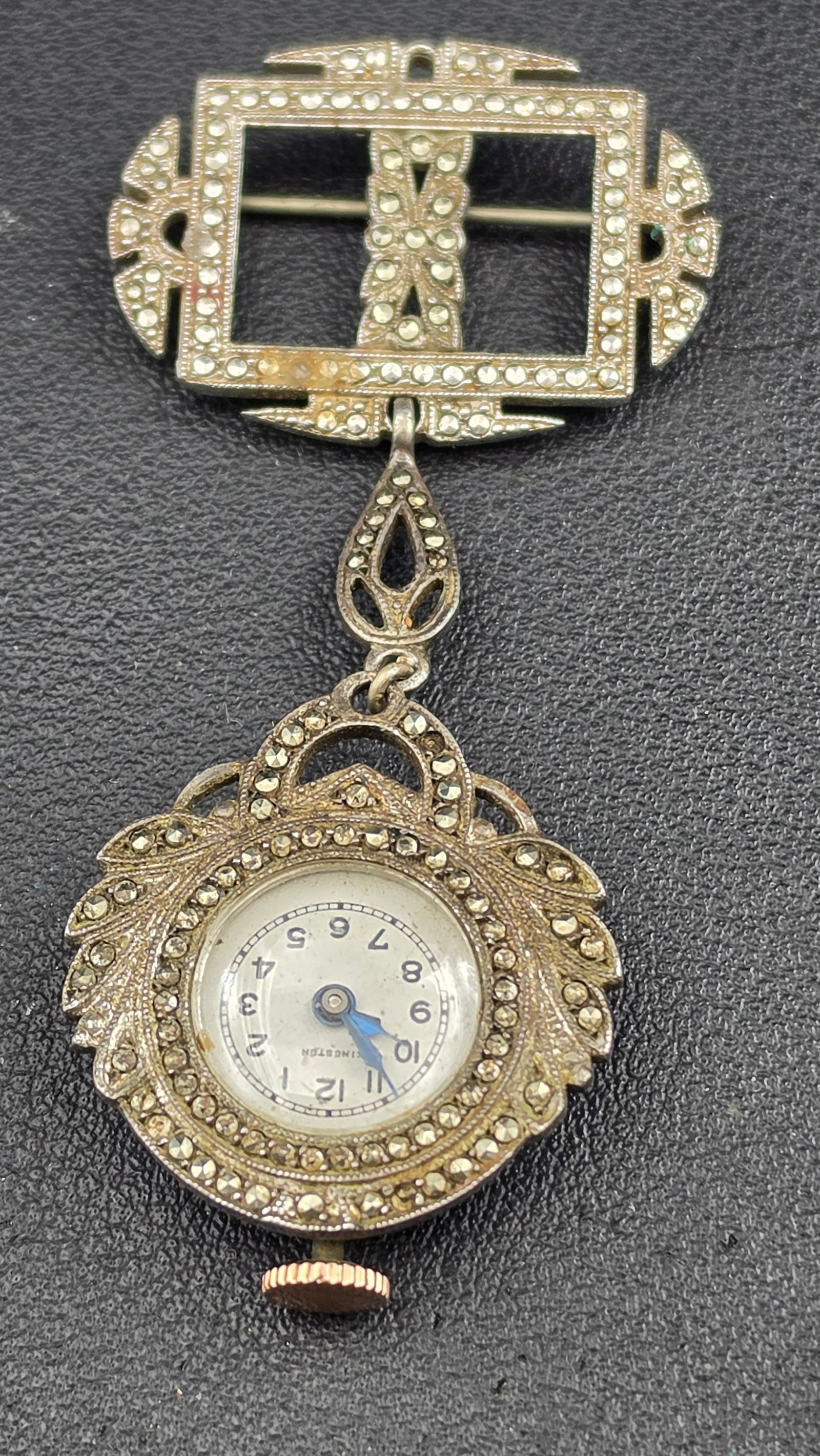 Vintage Crawford Art Deco Sterling Silver Marcasite Lapel Watch, Bow Brooch, 17 Jewels, Running: Vintage 1930s Crawford lapel watch in sterling silver (stamped Sterling), set throughout with marcasite in an Art Deco leaf and wreath design. The circular watch head measures approximately 27.5mm and