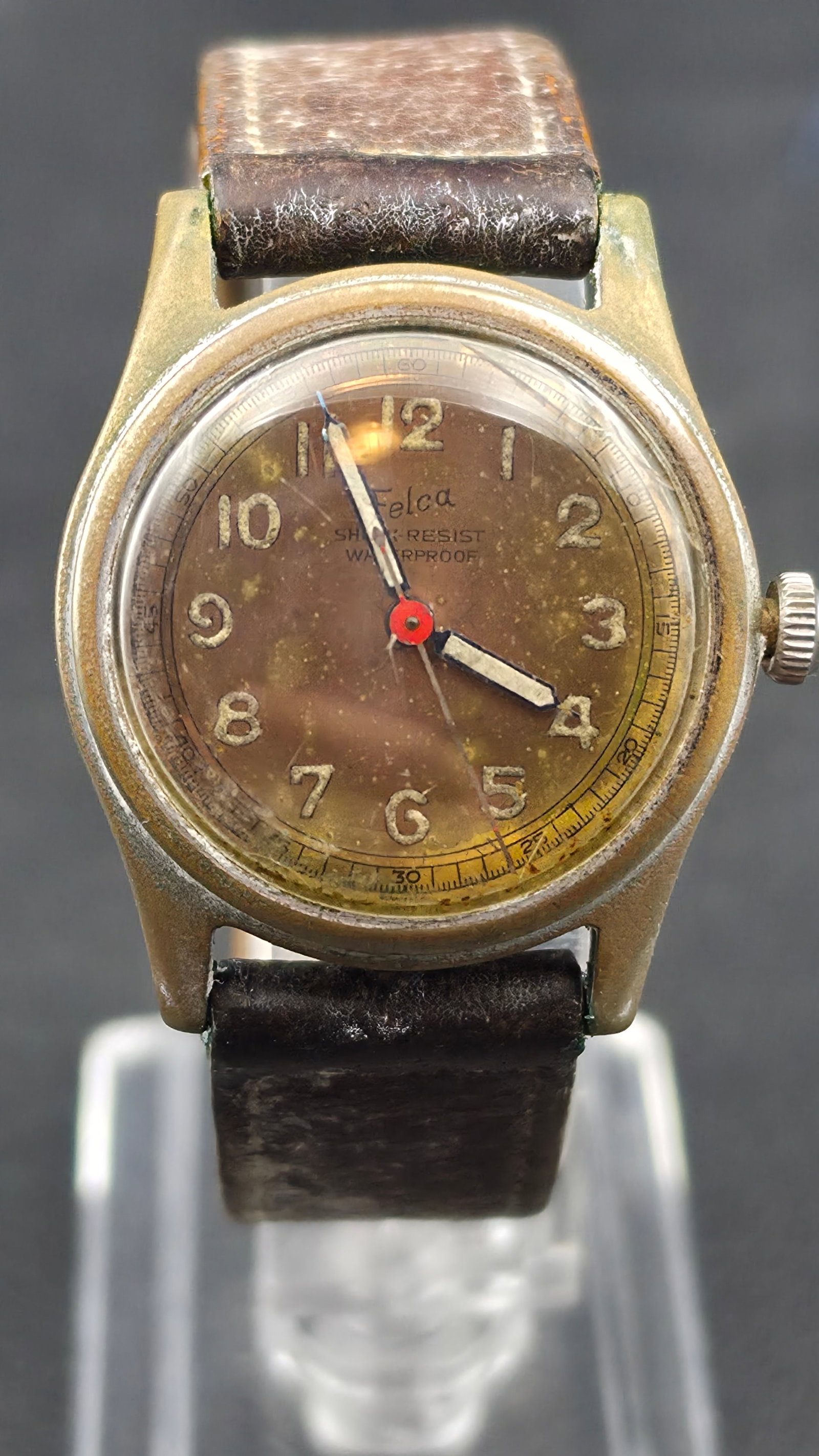 Vintage Felca Shock Resist Waterproof Mens Watch, 17 Jewels, Antimagnetic, Military Style: Vintage Felca wristwatch in a round chrome plated case measuring approximately 30.7mm. Dial signed Felca, Shock Resist, Waterproof, with cream Arabic numerals, blued steel hands, a red-centered sweep 