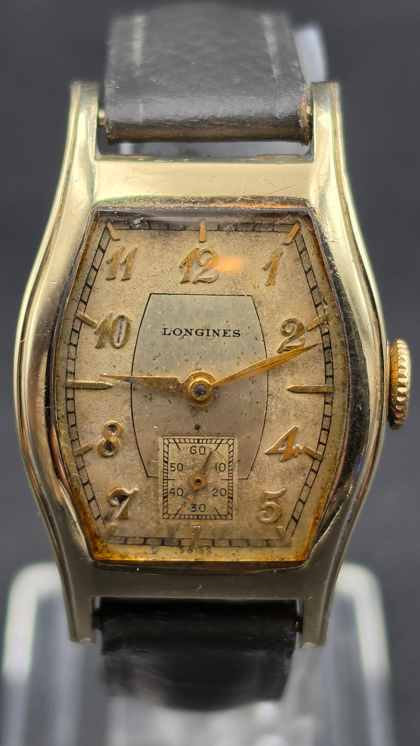 Vintage Circa 1938 Longines Tonneau Watch, Cal. 10L, 15 Jewels, 10K Gold Filled Case, Running: This is a vintage Longines Art Deco tonneau (barrel-shaped) wristwatch. The dial is signed "Longines" with gold Arabic numerals, a small seconds subdial with 60-minute style scale, and gold hands. The