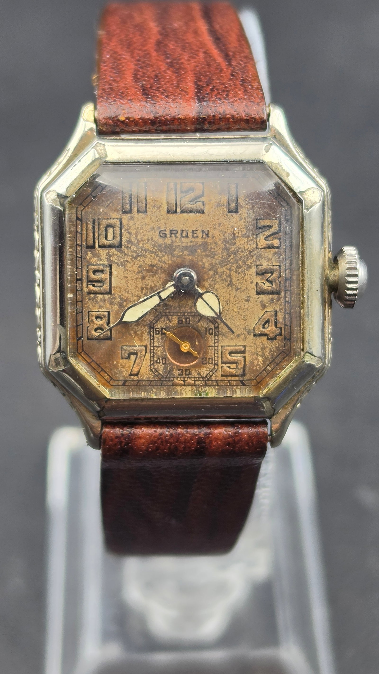 1920s Gruen Guild Octagon Watch, 15 Jewels, 14K White Gold Filled Case, Sub-Seconds Dial: This is a 1920s Gruen Guild wristwatch in an Art Deco octagon case, 14K white gold filled. The tarnished dial is signed "Gruen" in black Arabic numerals with a sub-seconds register at 6 o'clock. The c