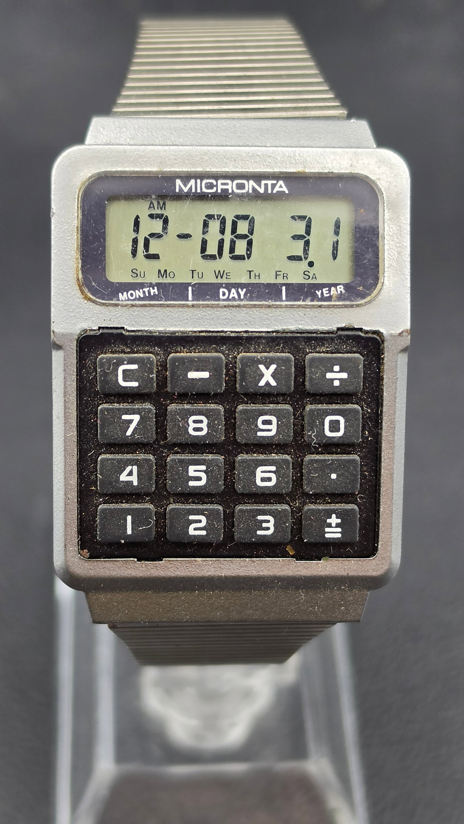 Micronta Calculator Alarm LCD Digital Watch Cat No 63-5071 Radio Shack Tandy Corp: A vintage Micronta digital calculator wristwatch, catalog number 63-5071, custom manufactured in China for Radio Shack, a division of Tandy Corp, Fort Worth TX. The LCD display shows month, day, and y