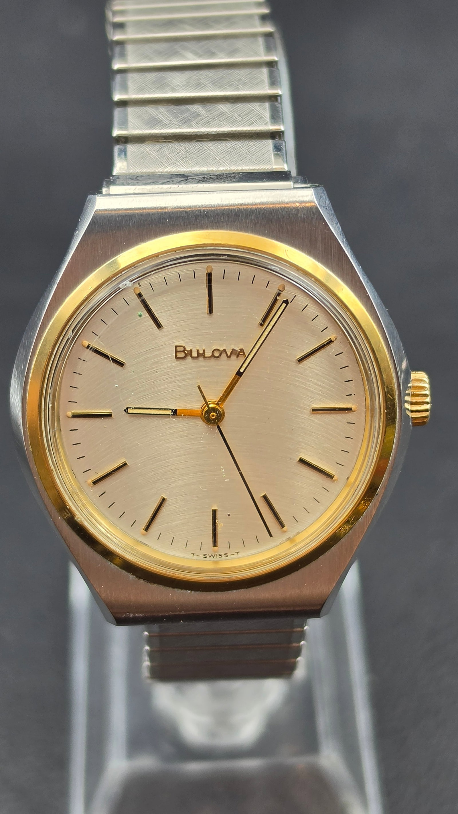 1978 Bulova Wristwatch, 17 Jewels, Two-Tone Case, T-Swiss-T Dial, Running: This is a vintage Bulova manual-wind wristwatch. The movement is signed BULOVA 112110, N8, UNADJUSTED, SWISS, SEVENTEEN 17 JEWELS — the "N8" case date code places production in 1978. Case diameter m