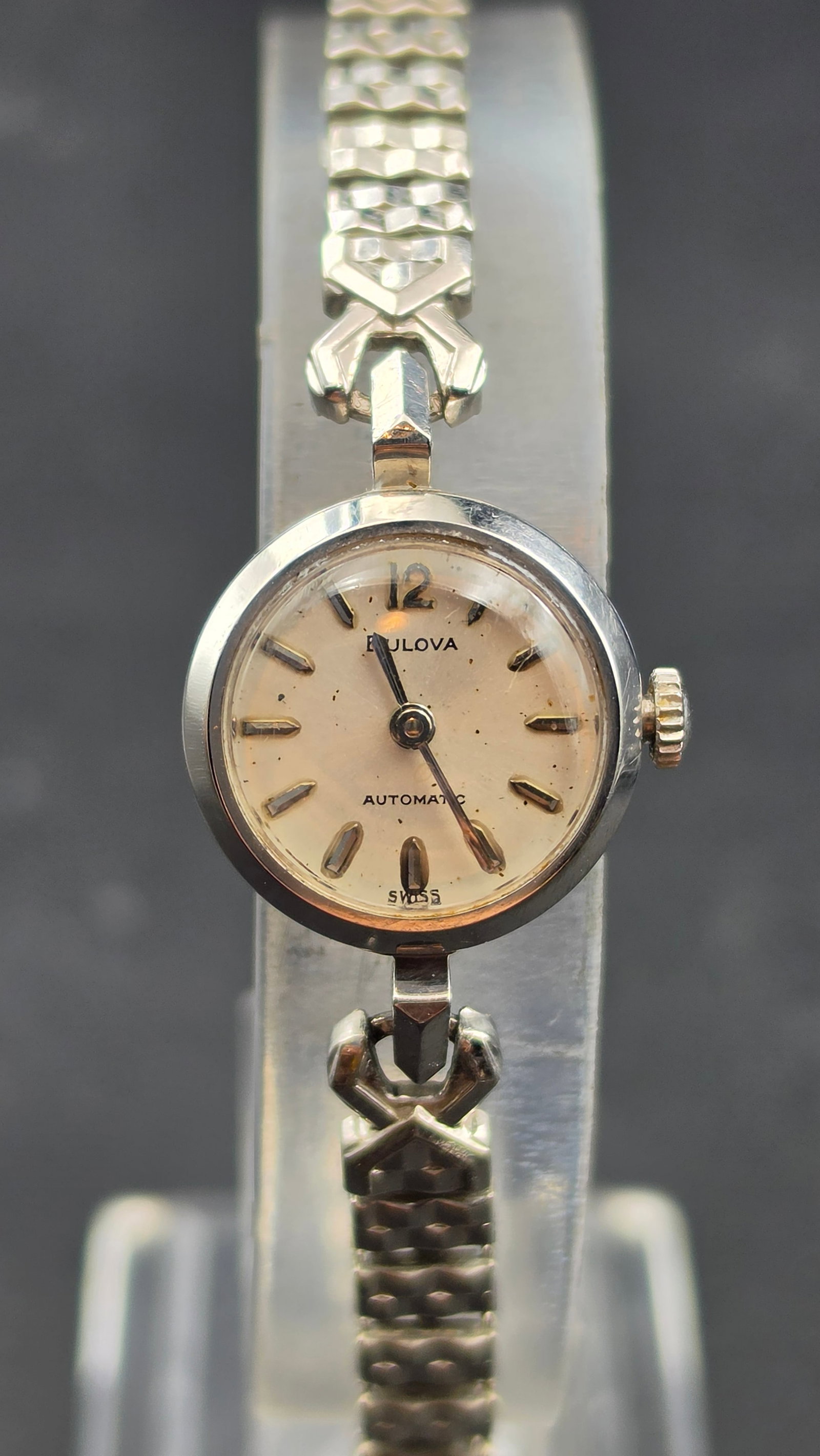 1969 Bulova Ladies Automatic Watch 17 Jewels Stainless Steel Speidel Band Running: This is a vintage Bulova ladies automatic wristwatch dating to 1969, confirmed by the M9 date code stamped on the case back alongside serial number T87059. The cream dial is signed Bulova, Automatic, 