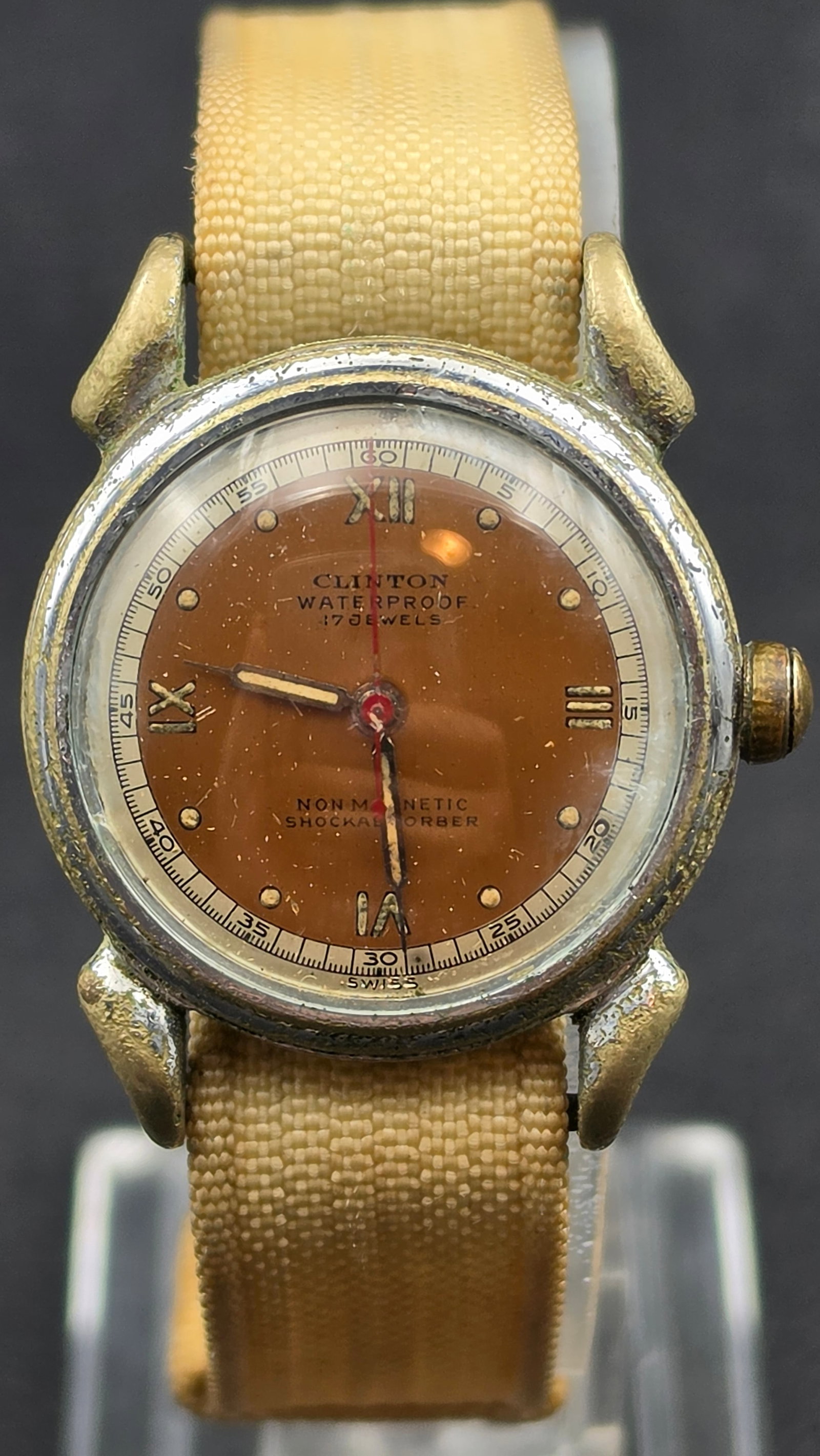 Clinton Watch Co. 1940s Waterproof 17 Jewel Manual Wind Watch, Stainless Steel, New Crystal: This is a 1940s Clinton Watch Co. men's wristwatch in a round stainless steel case, case back marked Antimagnetic Shockabsorber, Waterproof, Stainless Steel Back. The manual-wind movement is signed Cl
