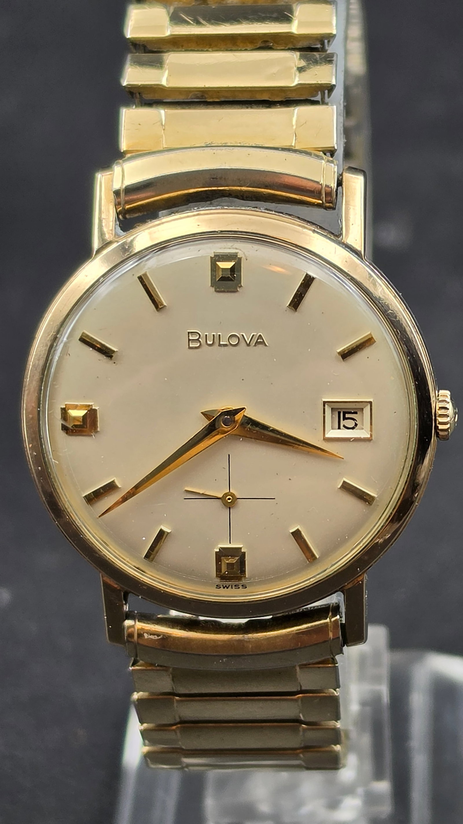 Bulova M8 Date Watch, 10K RGP Bezel, Stainless Steel Back, 17 Jewels: This is a vintage Bulova M8 men's wristwatch in a round case with a 10K rolled gold plate bezel and stainless steel back, case number F864970, measuring approximately 32.22mm wide excluding the crown.