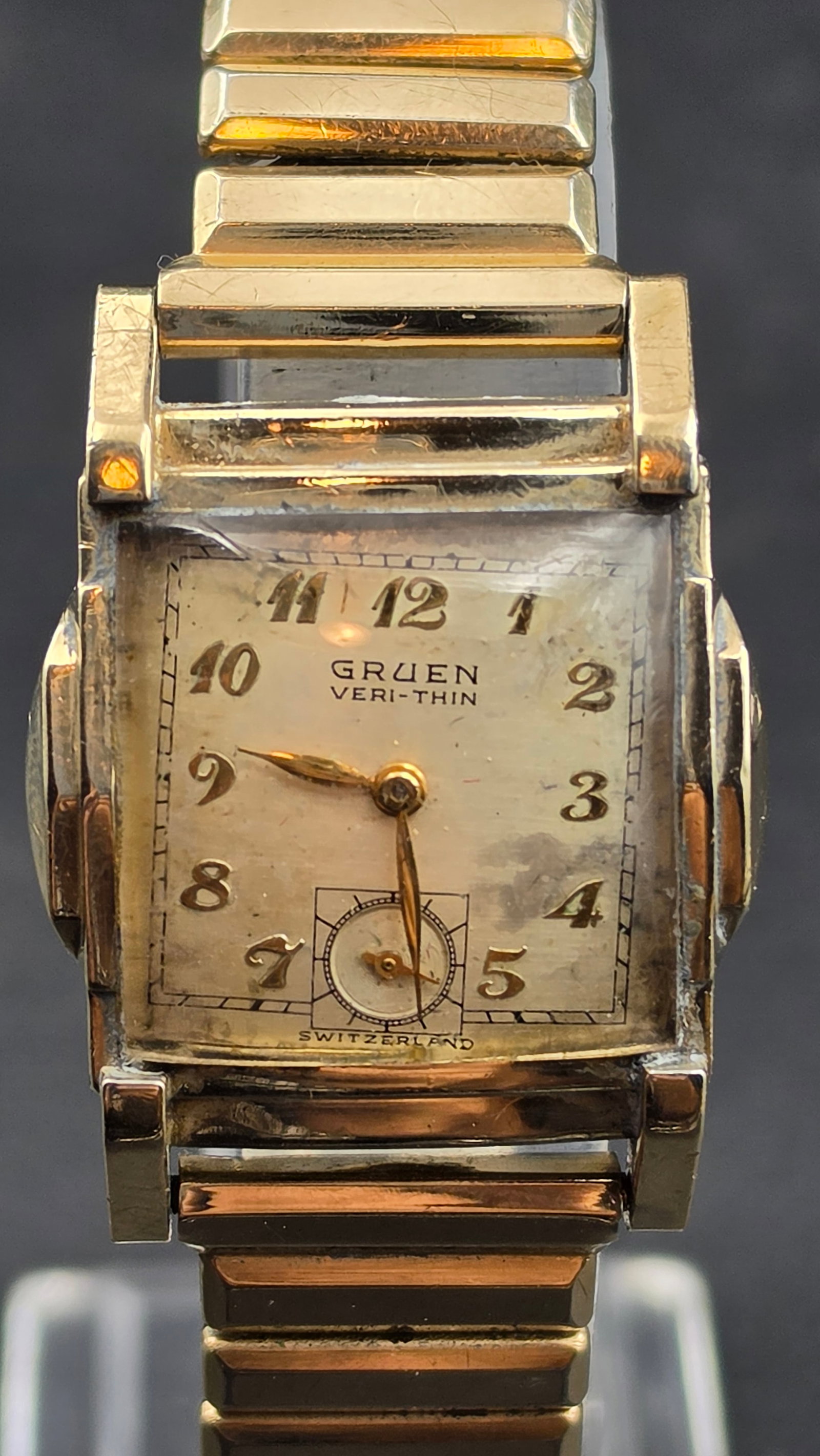 1949 Gruen Veri-Thin Cal. 421 15 Jewel 10K Gold Filled Art Deco Mens Watch with Kreisler Band: This is a Gruen Veri-Thin mens wristwatch with a rectangular Art Deco tank case in 10K gold filled with a steel snap back, stamped GRUEN 10K G.F. BEZEL STEEL BACK and CASED AND TIMED IN U.S.A. BY THE 
