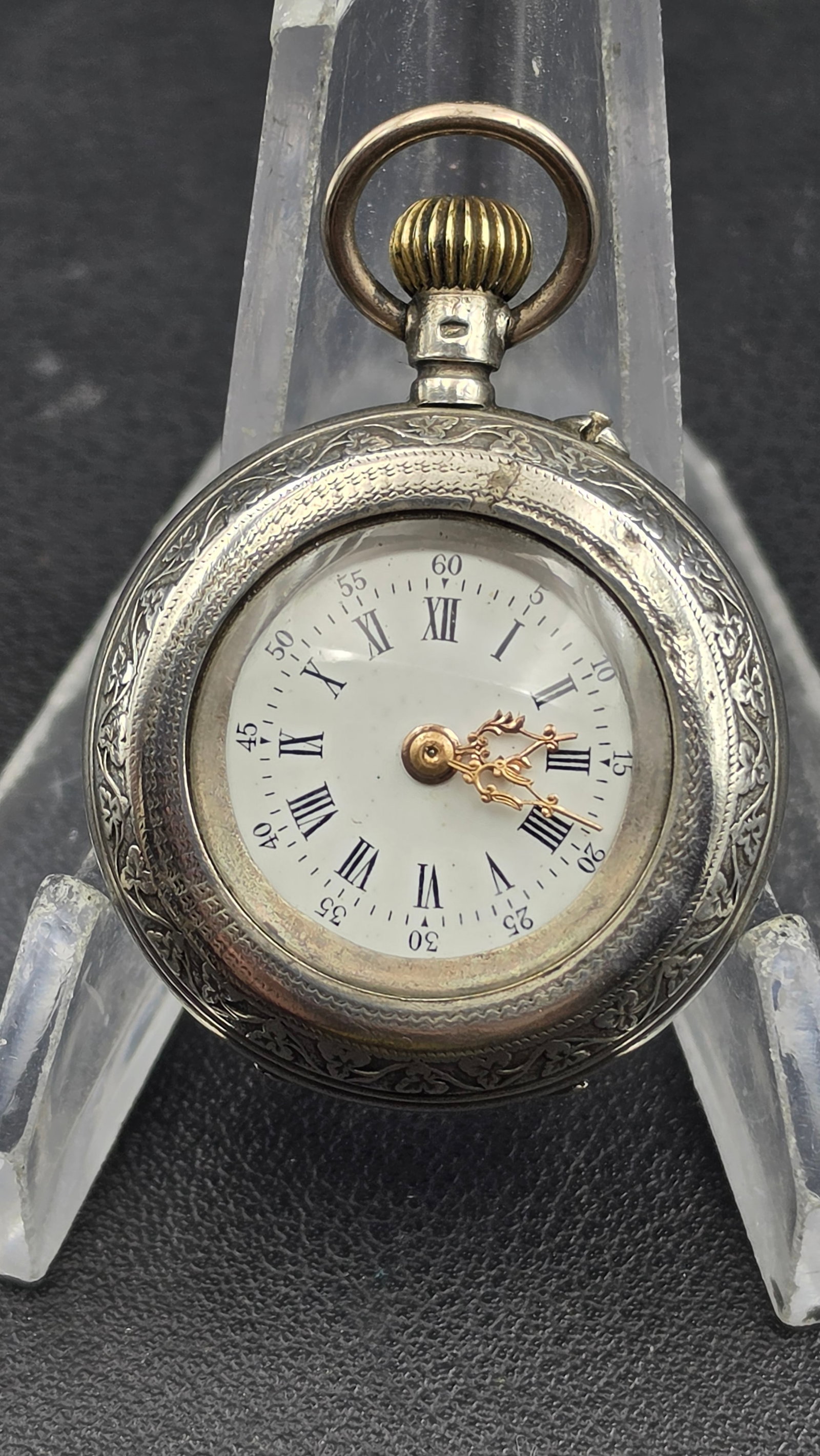 Antique Swiss K&M Silver Fob Watch 0.800 Engraved Case Roman Numerals Runs: Antique Swiss ladies' fob/pendant watch, circa 1880-1900s. Case in 0.800 fine silver with an elaborately engraved floral bezel and engine-turned back panel, case back hallmarked "K&M 0.800," serial 28