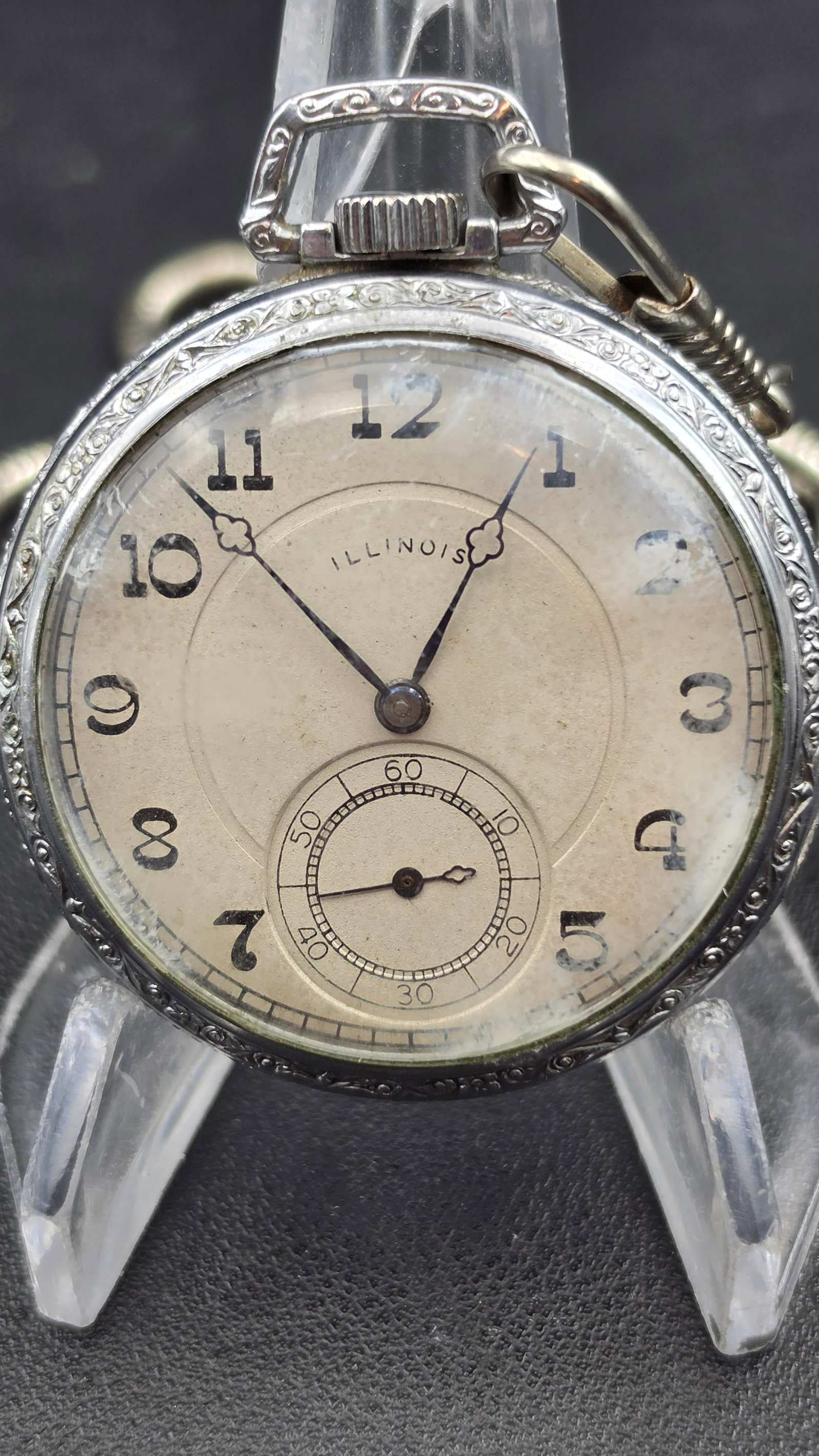 Illinois Watch Co Grade 405 Pocket Watch, 17 Jewels, 12s, Defiance Case, 1927: This antique pocket watch has a nickel alloy case marked Defiance, serial number 8172912, engraved on the bezel and back with scrolling floral motifs and monogrammed CW on the case back. The movement 
