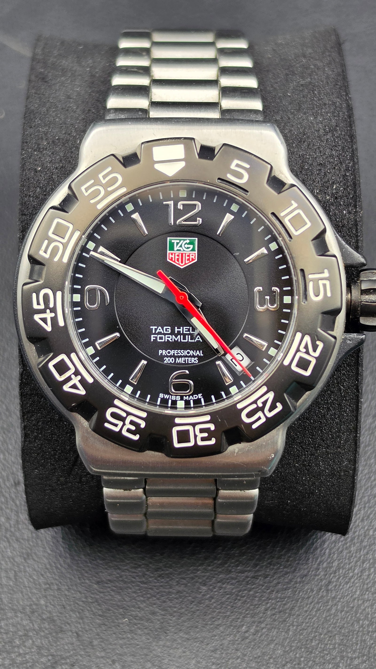 TAG Heuer Formula 1 Professional 200M Black Dial Quartz Watch Ref. WAC1110-0 Full Set New Battery: This TAG Heuer Formula 1 Professional 200M is reference WAC1110-0, a Swiss-made quartz diver-style sport watch with a black dial, luminous baton and Arabic hour markers, red sweep seconds hand, date w