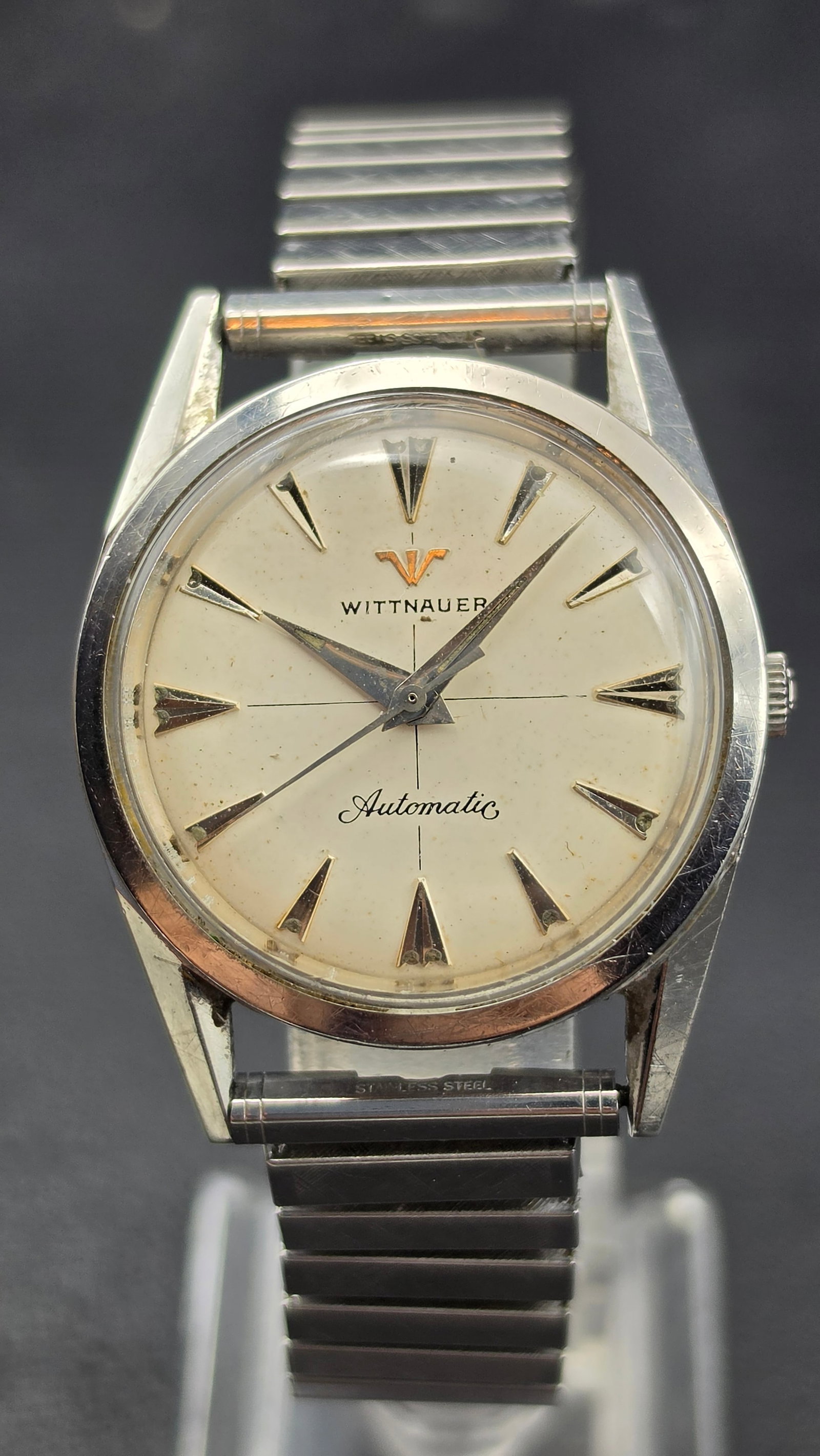 Vintage Wittnauer Automatic 17 Jewel Stainless Steel Watch Cal. 11SR Running: This is a vintage Wittnauer Automatic wristwatch with a silvered dial, applied dagger-style hour markers, and dagger hands, signed Wittnauer and Automatic. The stainless steel case is signed Wittnauer