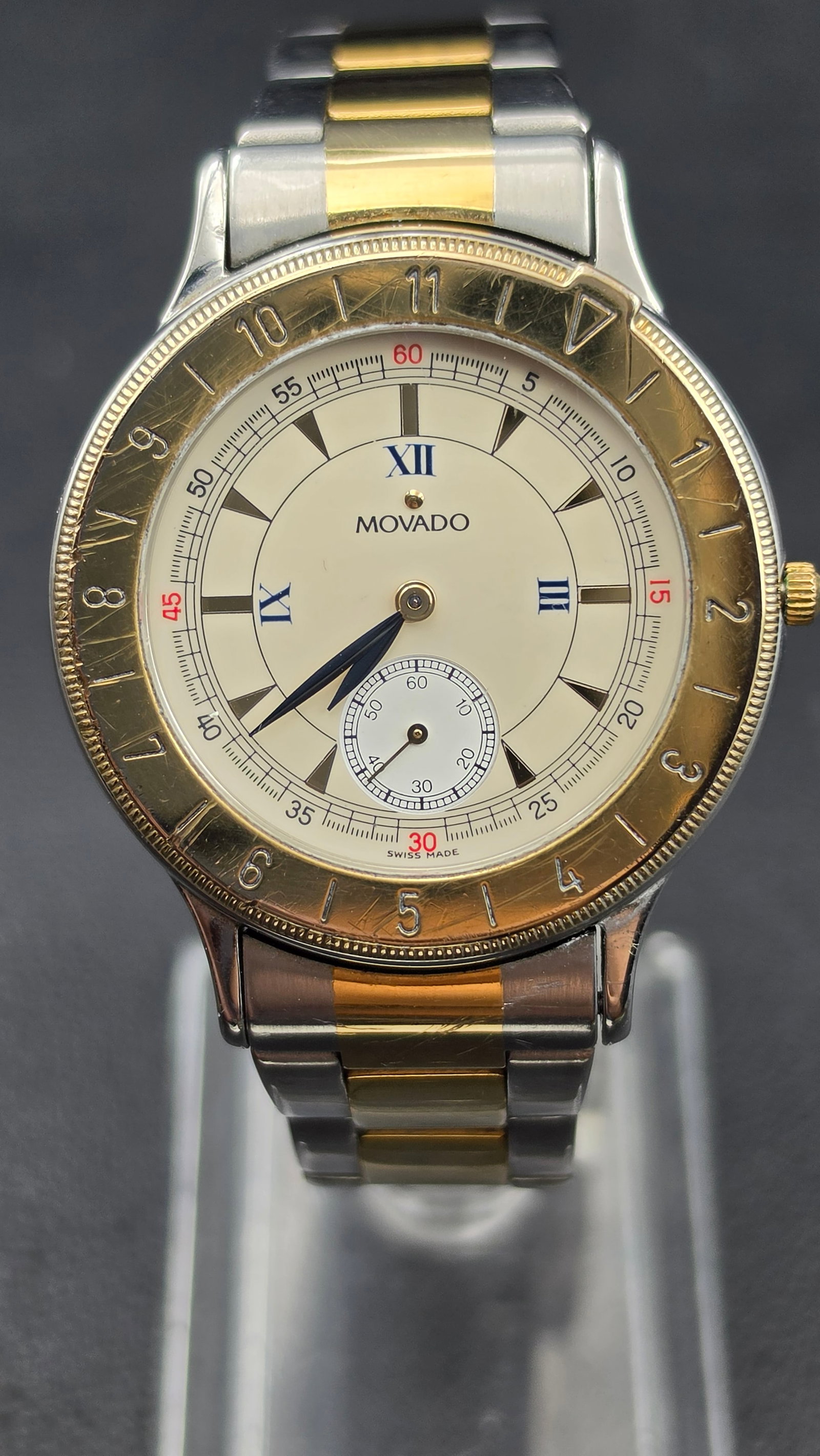 Movado 81.09.861 Two Tone Steel Quartz Wrist Watch 35mm White Dial 1990s Running New Battery: This is a Movado reference 81.09.861 two tone stainless steel quartz wristwatch with a 35mm case. The white dial reads MOVADO below the twelve position and is marked SWISS MADE at the base, with blue 