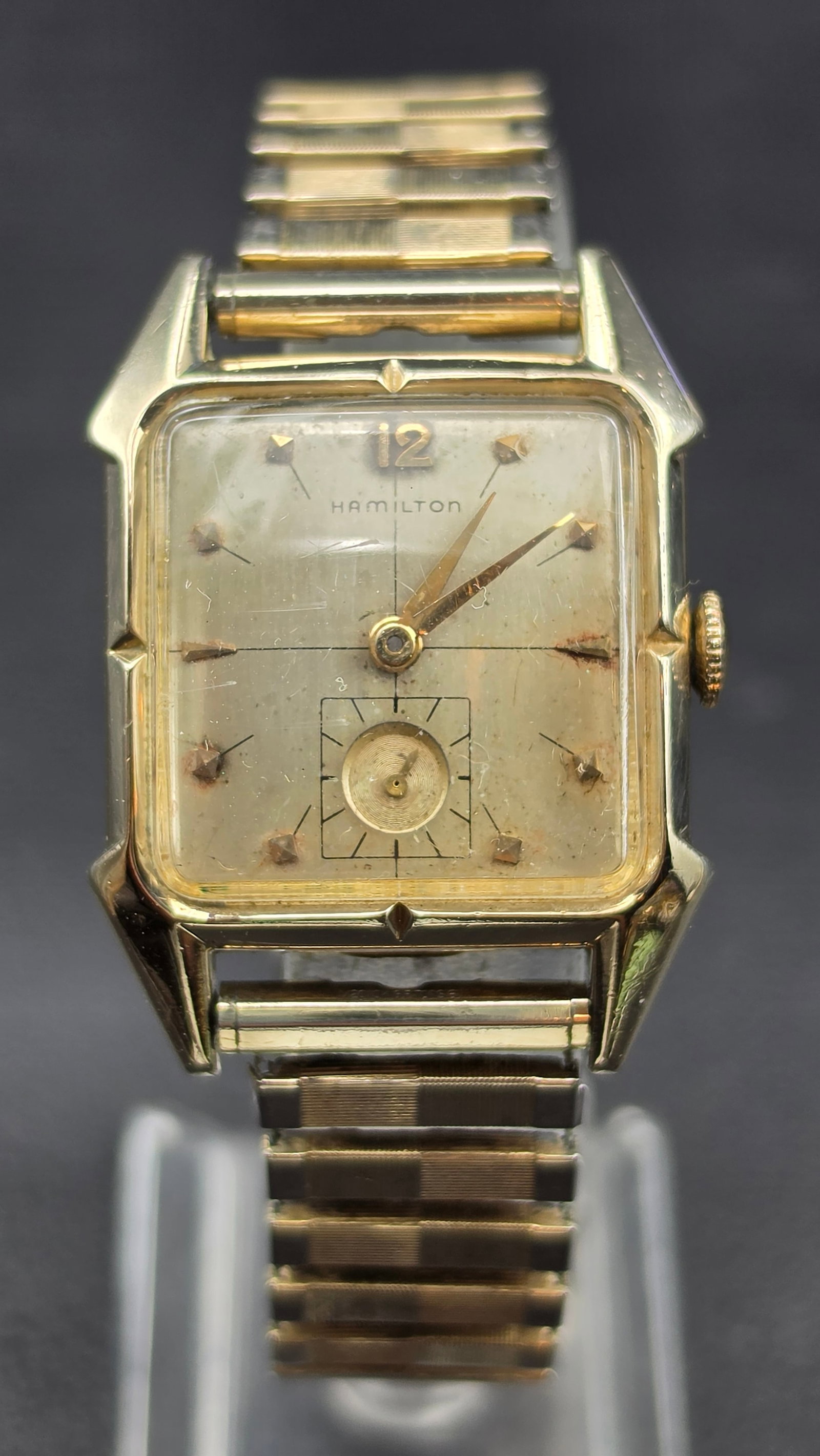 Hamilton Murray 10K Gold Filled Cal 747 17 Jewel Watch 29mm 1950s Running: This is a Hamilton Murray wristwatch with a case measuring 29mm in width and distinctive angled lugs. The dial has a crosshair pattern with applied dagger style hour markers, an Arabic 12, a sub-secon