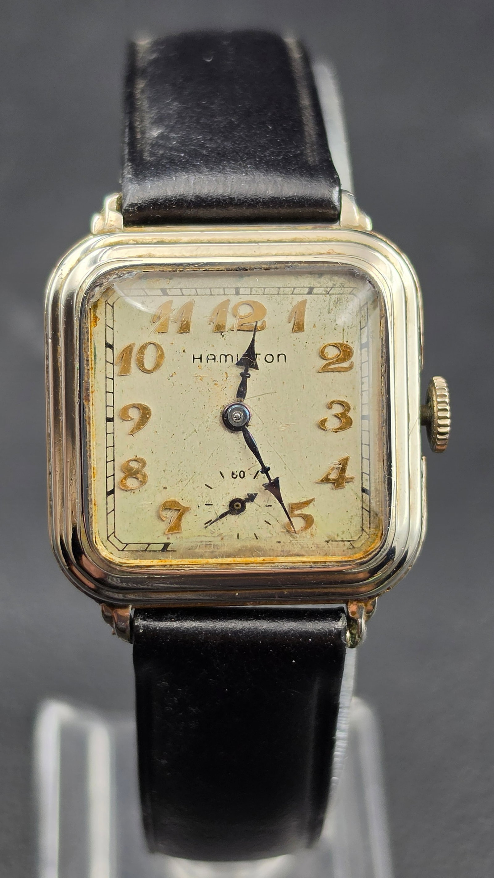 Hamilton Cushion 14K White Gold Filled Cal 987F 17 Jewel Watch 28mm 1930 Running: This is a Hamilton cushion case wristwatch with a case measuring 28mm in width. The dial is signed Hamilton with Arabic numerals, a sub-seconds register at 6 marked 60, and blued spade style hands. Th