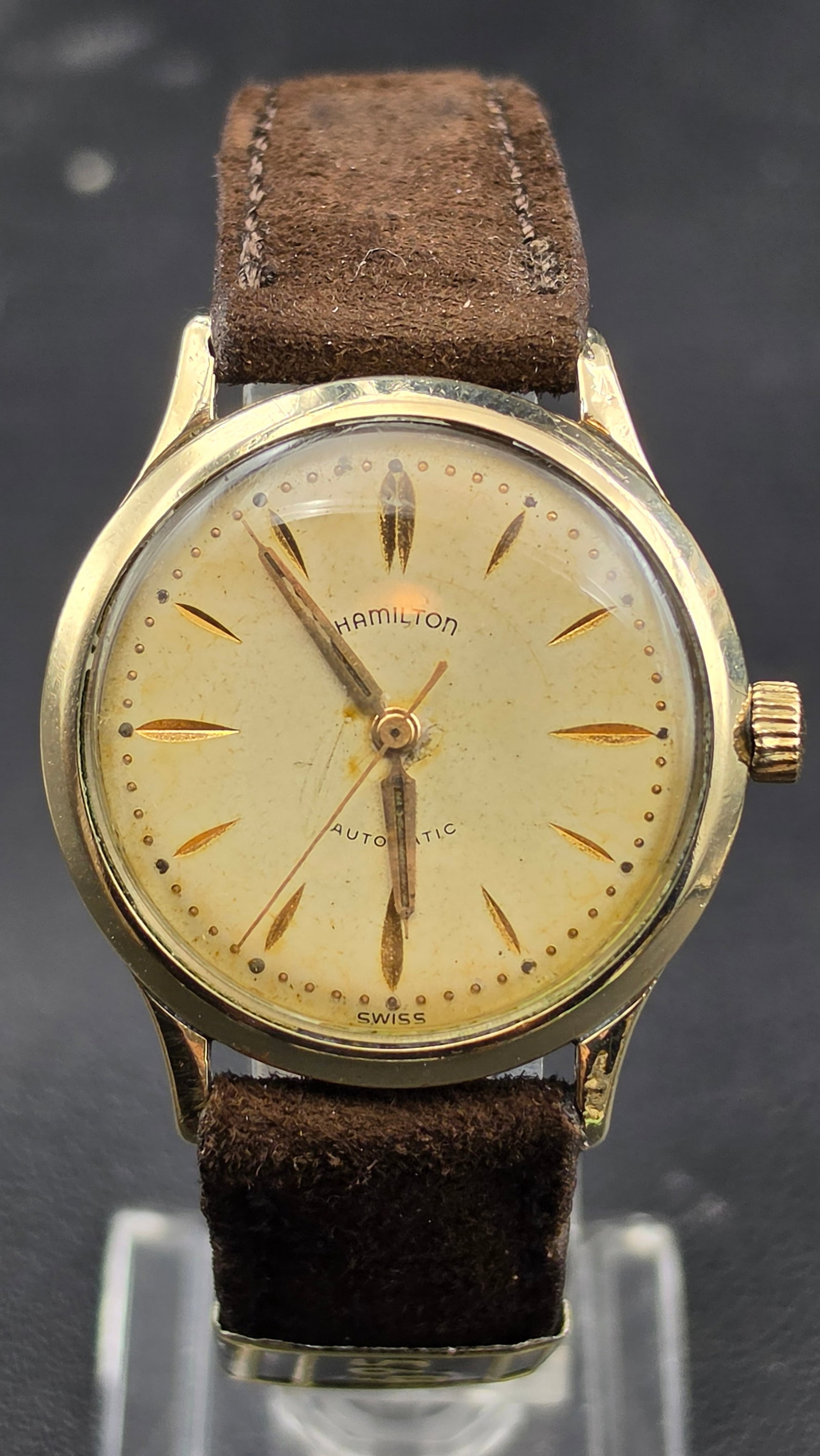 Hamilton Automatic Micro Rotor 10K Gold Filled Cal 666 17 Jewel Watch 34mm 1950s Running: This is a Hamilton Automatic wristwatch with a case measuring 34mm in diameter. The dial reads Hamilton, Automatic, and Swiss, with applied marquise style hour markers, a dotted minute track, and daup