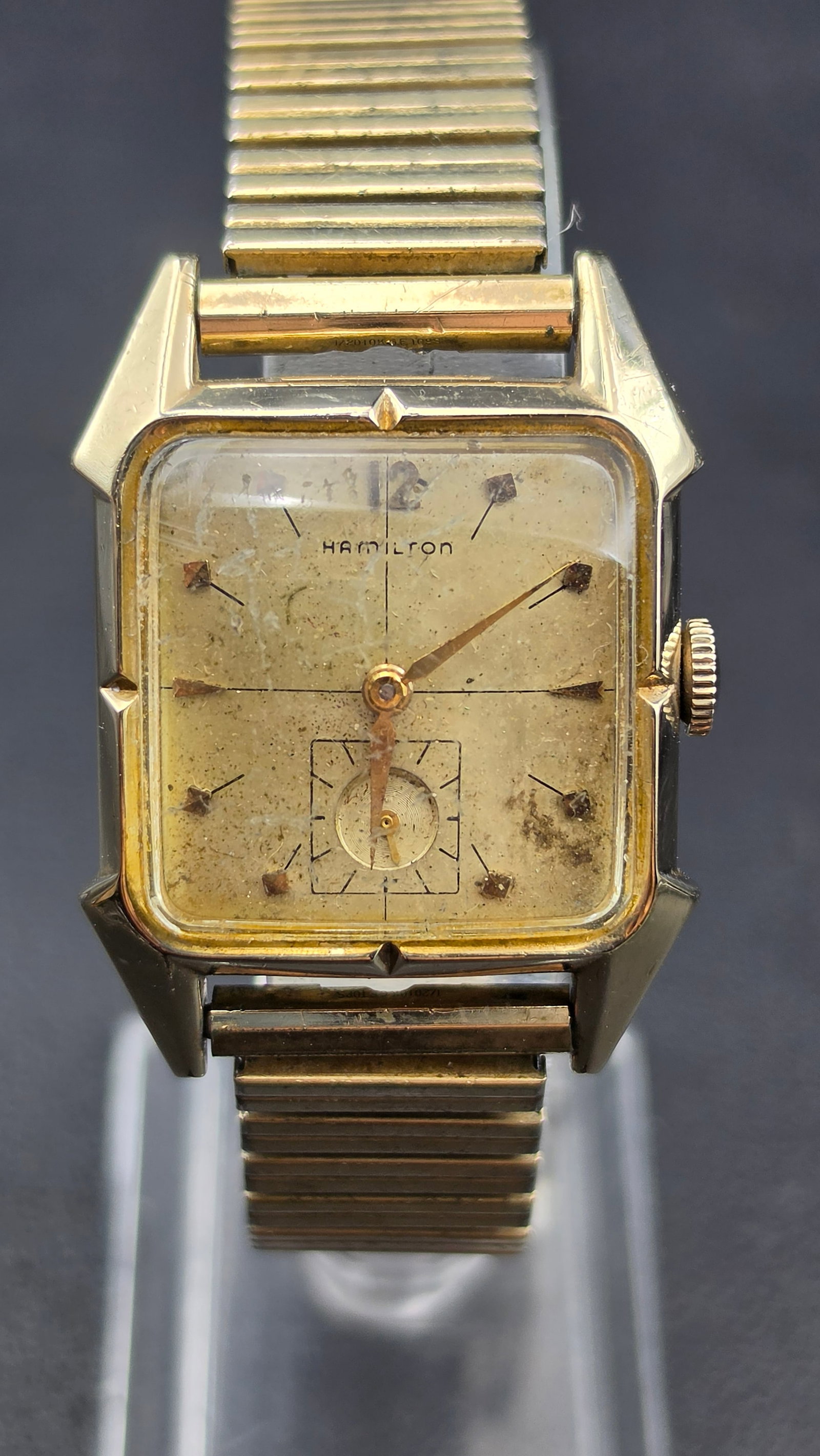 Hamilton Murray 10K Gold Filled Cal 730 17 Jewel Watch 1950s: This is a Hamilton Murray wristwatch with distinctive angled lugs. The dial is signed Hamilton with applied diamond shaped hour markers, a sub-seconds register at 6, and gold tone hands. The case back