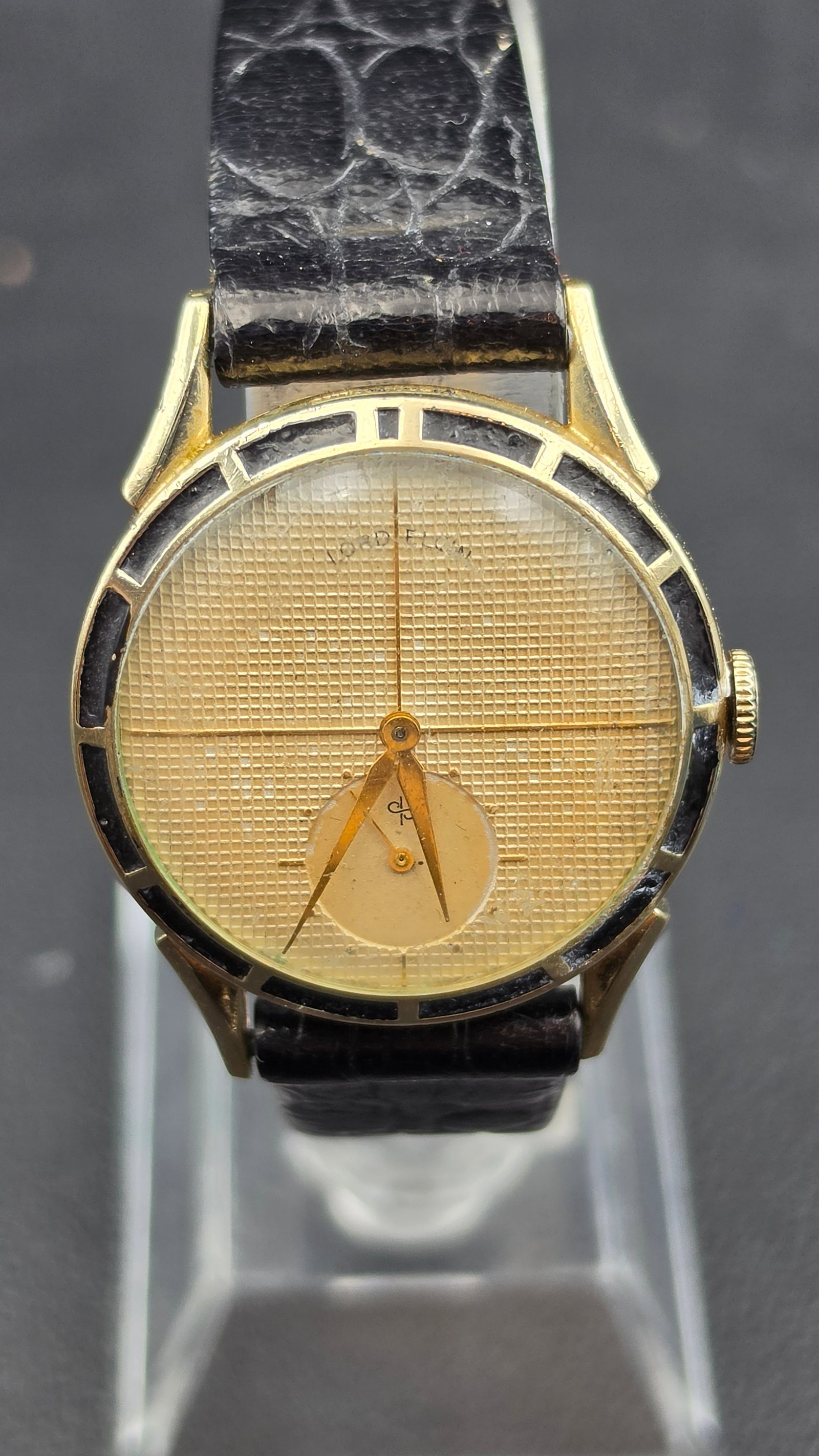 1952 Lord Elgin Clubman Ref 4811 Cal 556 21 Jewel 14K GF Waffle Dial Wristwatch: This is a Lord Elgin Clubman, model reference 4811, powered by the Elgin grade 556 manual wind movement with 21 jewels, adjusted, and signed Elgin U.S.A. on the plate. The case is 14K gold filled, mad