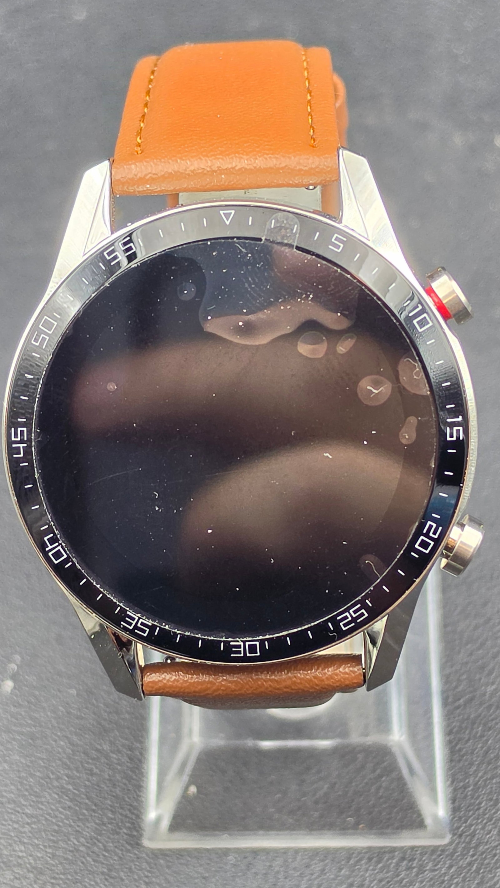 Smart Watch with Heart Rate Monitor IP68 Waterproof Brown Leather Band New in Box: This is a smartwatch featuring a round stainless steel case with a tachymeter-style bezel and a brown leather two-piece strap. The case back is marked Smart Wearable Device, IP68 Waterproof, with a bu