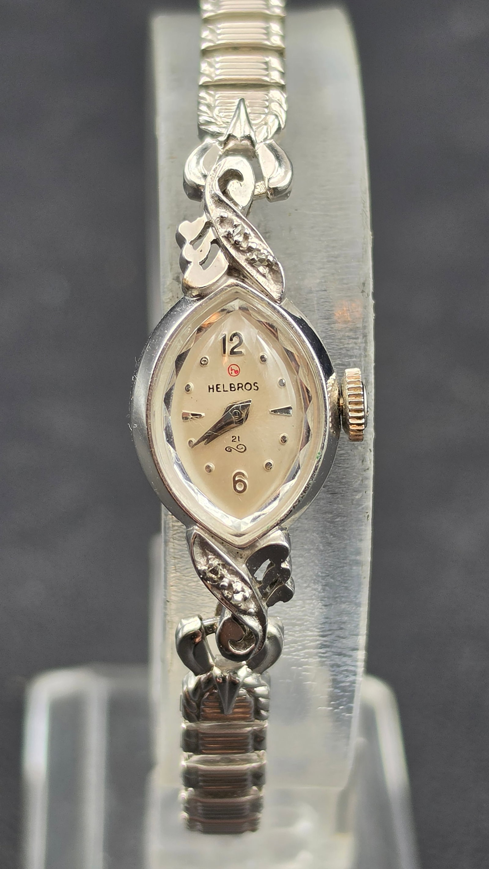 Vintage Helbros Chanel 21 Jewel Diamond Accent Ladies Watch NOS in Box: This is a Helbros ladies cocktail watch, model Chanel, signed Helbros on the marquise-shaped dial with diamond-cut crystal edges and the number 21 marking the jewel count. The scrolled lugs are set wi