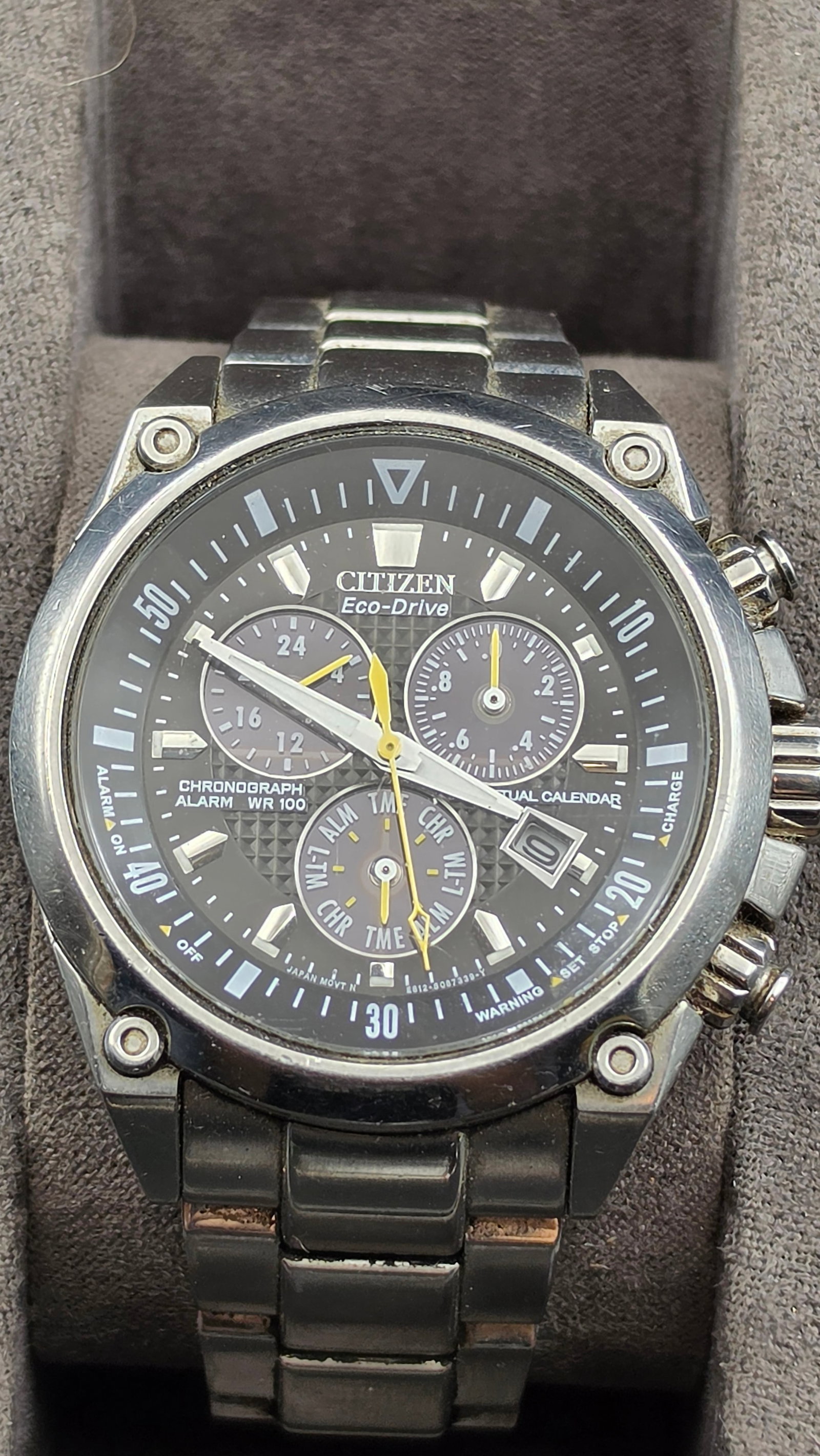 Citizen Eco-Drive Perpetual Calendar Chronograph Alarm Watch, Ref E812, WR100, Box: This Citizen Eco-Drive chronograph features caliber E812 with a perpetual calendar, 12/24 hour subdial, alarm, and date display, on a black dial signed Citizen Eco-Drive with luminous baton markers an