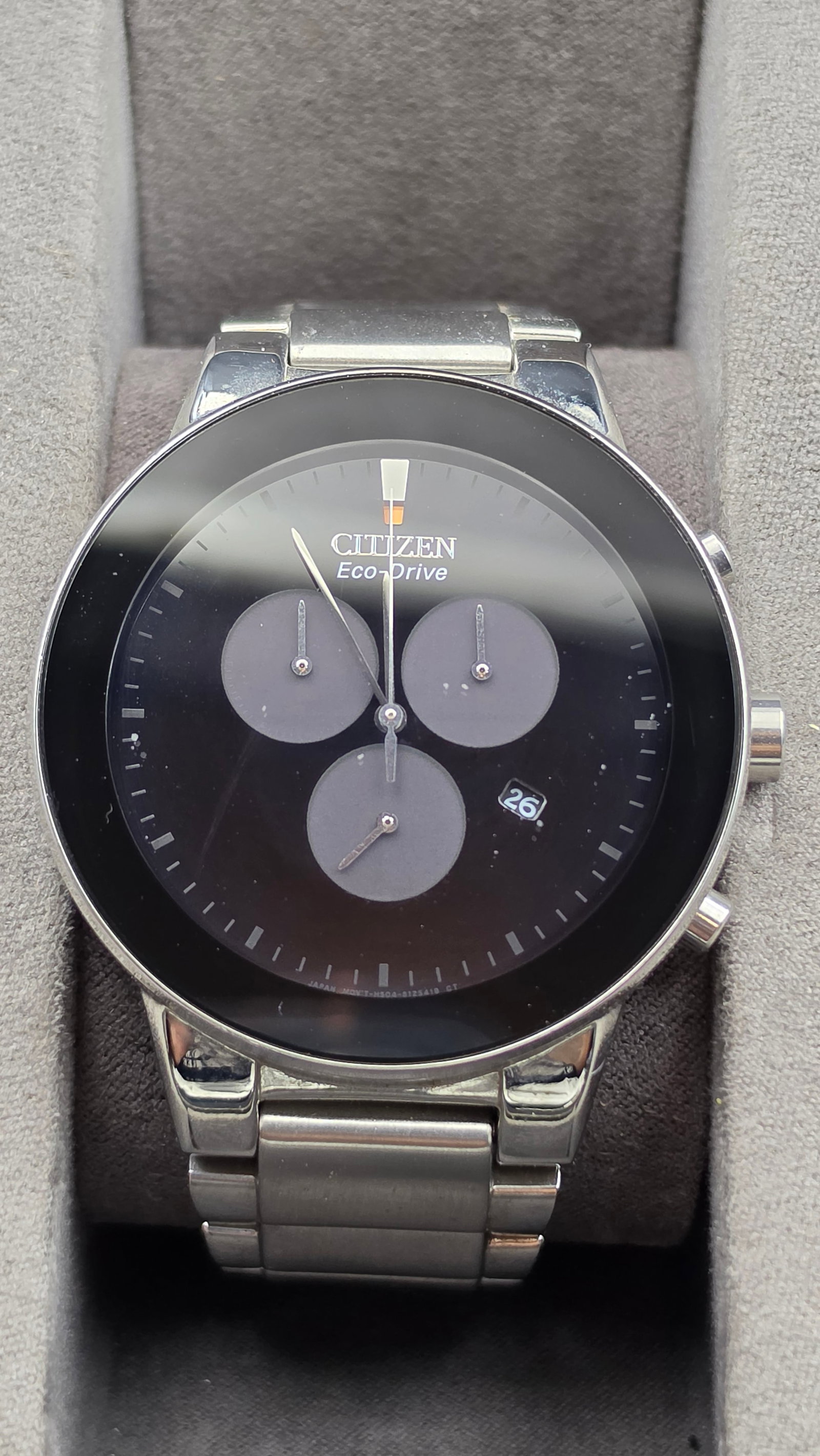 Citizen Eco-Drive Axiom Chronograph Wristwatch, Ref H504, Box & Papers: This Citizen Eco-Drive Axiom chronograph features caliber H504, with a black dial signed Citizen Eco-Drive, edge-to-edge domed mineral crystal, three tone-on-tone chronograph subdials (60 second, 60 m