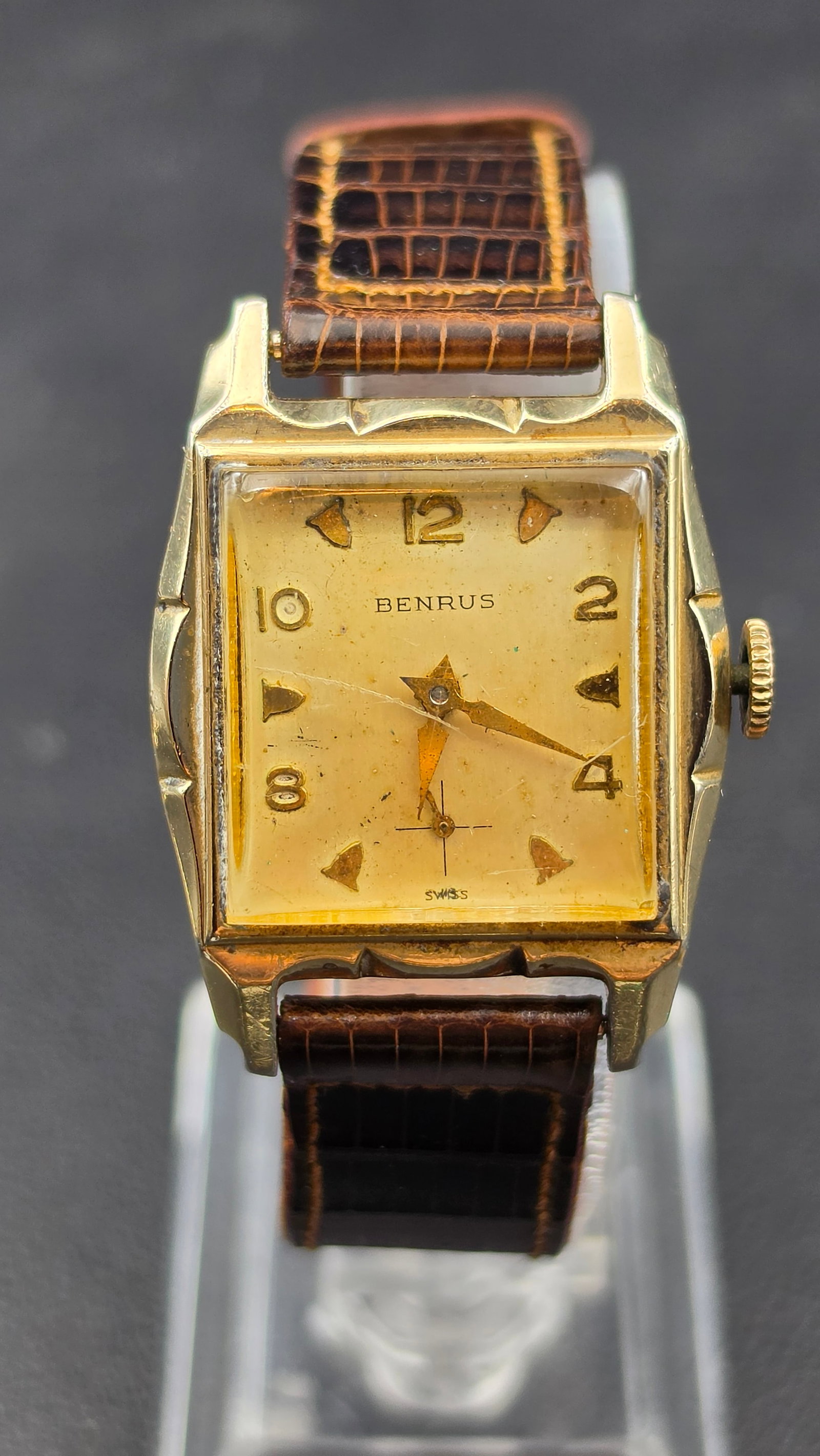 Vintage 1940s Benrus 17 Jewel Art Deco Watch, 10K RGP Bezel, Model DN21: This vintage manual wind wristwatch is signed Benrus on a square dial with applied gold tone Arabic numerals and arrow markers, marked Swiss. The case measures approximately 25mm across and the case b