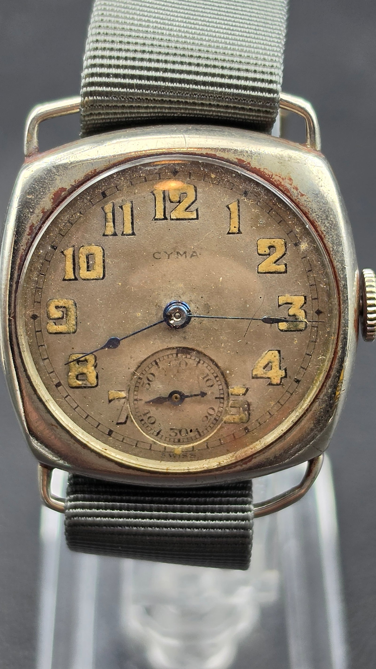 Vintage 1930s CYMA Tacy Watch Co Trench Watch 6 Jewel Cushion Case Running: This vintage CYMA trench-style wristwatch has a cushion-shaped case housing a manual-wind movement signed CYMA and Tacy Watch Co., marked 6 Six Jewels and 2 Two Adjs. The dial is signed CYMA with Arab