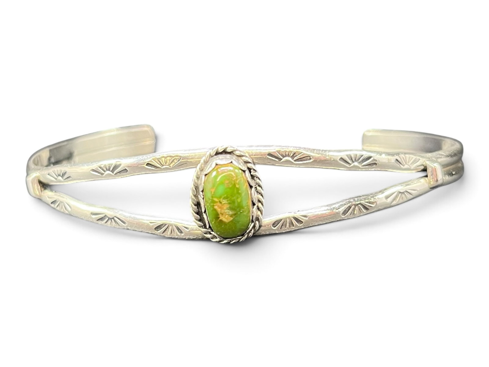 9g Navajo Sterling Silver Cuff Bracelet with Sonoran Gold Turquoise Cabochon: Handcrafted sterling silver cuff bracelet in the Navajo style, featuring a split double-bar shank decorated with a hand-chiseled sunburst (fan) stamp pattern along both bars. The center is set with a 