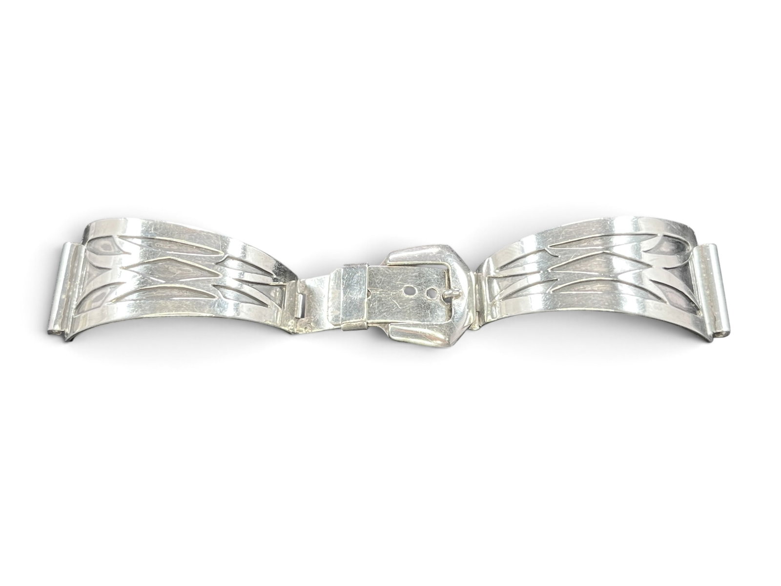 24g Sterling Silver Southwestern-Style Watch Band with Cut-Out Feather Motif: Silver wristwatch band of adjustable buckle-and-strap form, built from shaped, gently curved silver links joined by pin hinges and closing with an integral silver buckle secured through a row of four 