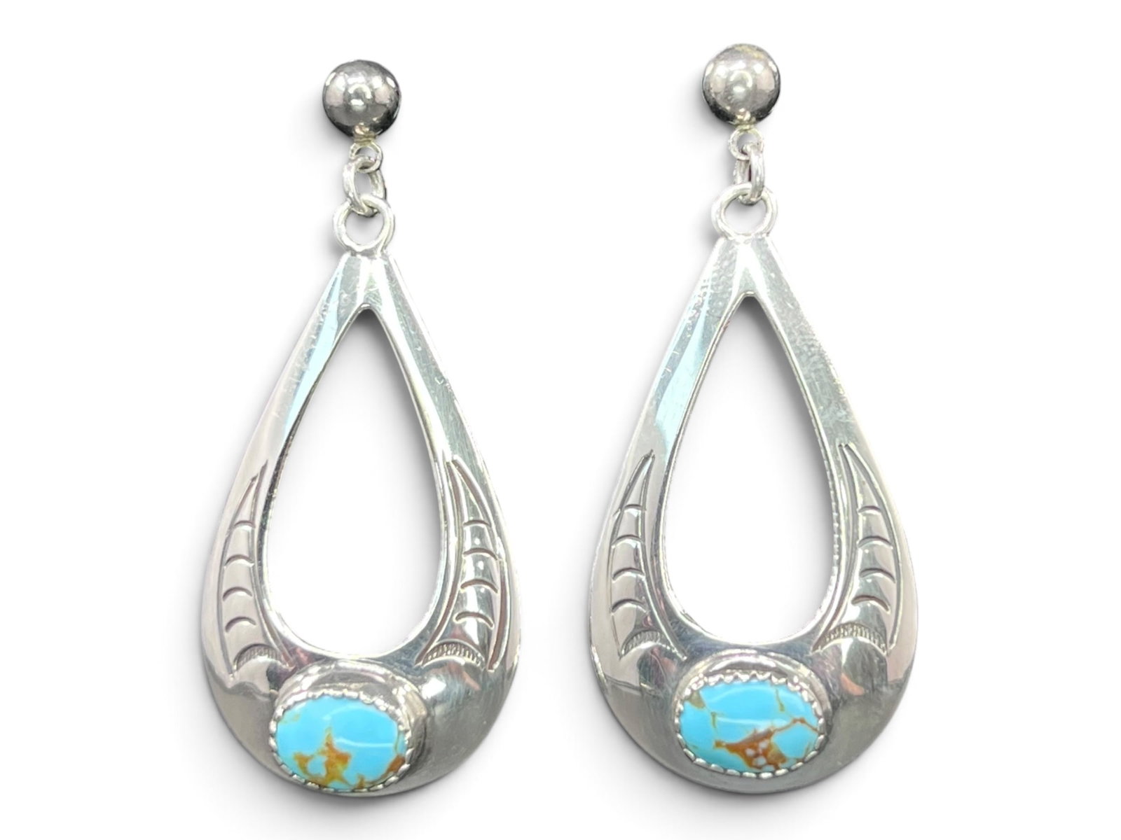 4g/1.4in Elegant Southwestern Open Teardrop Sterling Silver Dangle Earrings: 4g/1.4in Southwestern Open Teardrop Sterling Silver Dangle Earrings.A pair of elegant open teardrop-shaped dangle earrings crafted in sterling silver. Each earring features a large open teardrop penda
