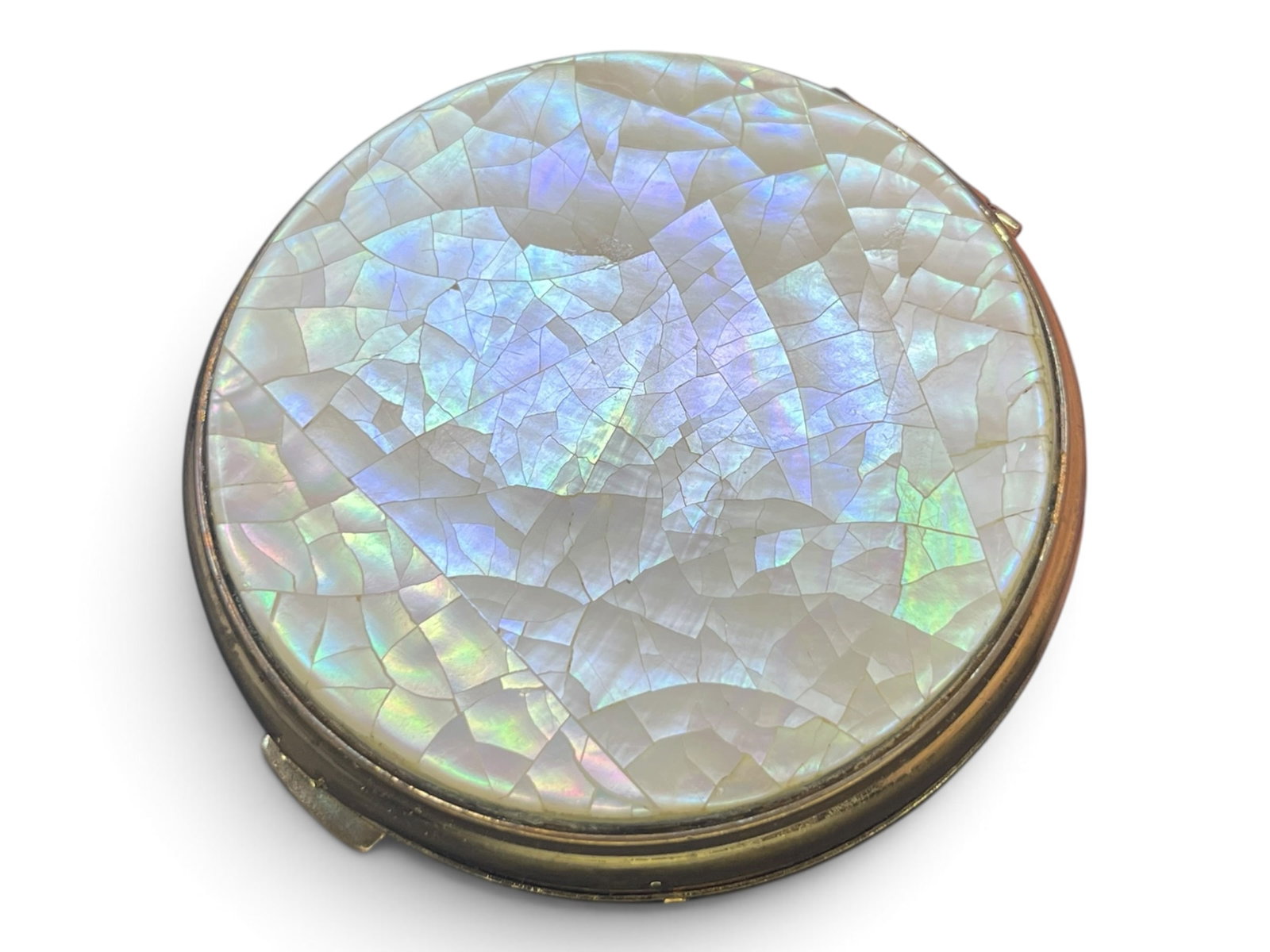 Emrich Mother of Pearl Mosaic Gold-Tone Powder Compact: Emrich Mother of Pearl Mosaic Gold-Tone Powder Compact. A vintage, post-war era classic vanity accessory. A round powder compact featuring an exquisite mosaic of crushed/fragmented mother of pearl pie
