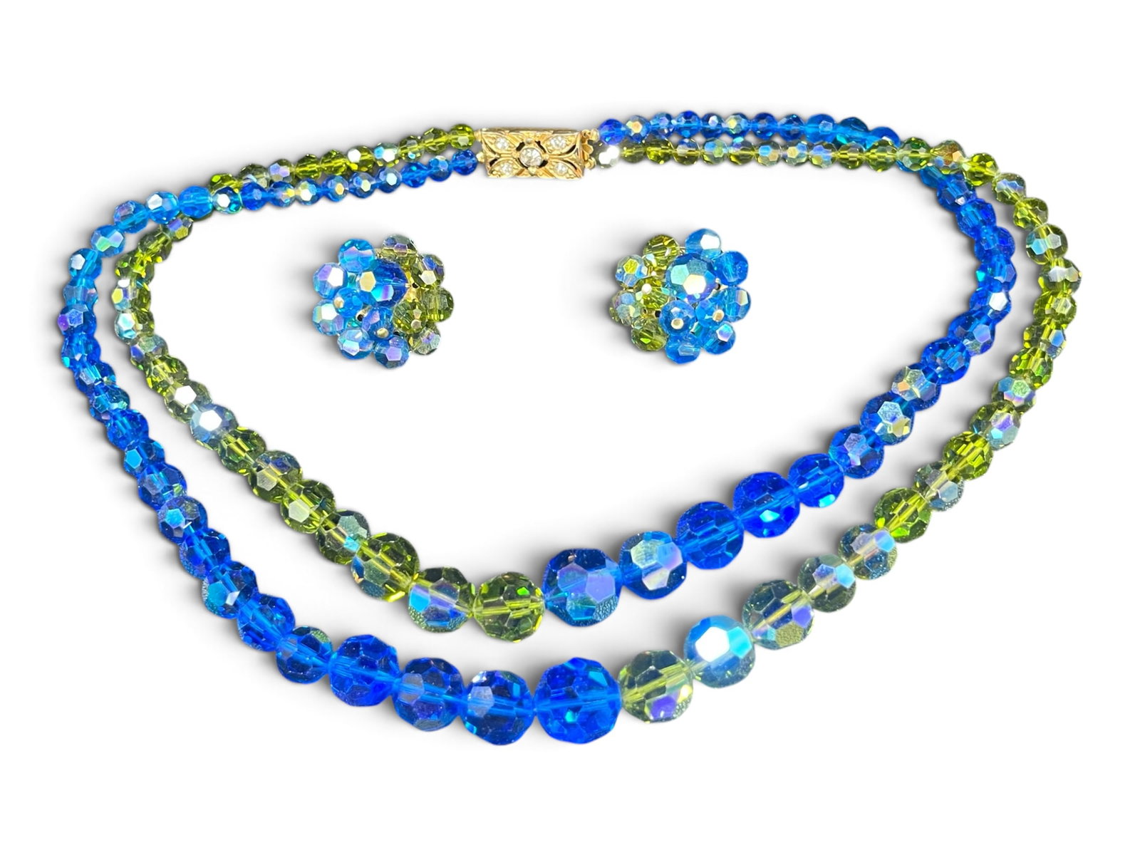 Set of Blue & Green AB Crystal Double Strand Necklace and Clip-on Cluster Earrings: Laying this set out on the pad, I checked the clasp closely and looked over the clip mechanisms on both earrings for any signature or stamped mark — I found none, so this set should be catalogued as