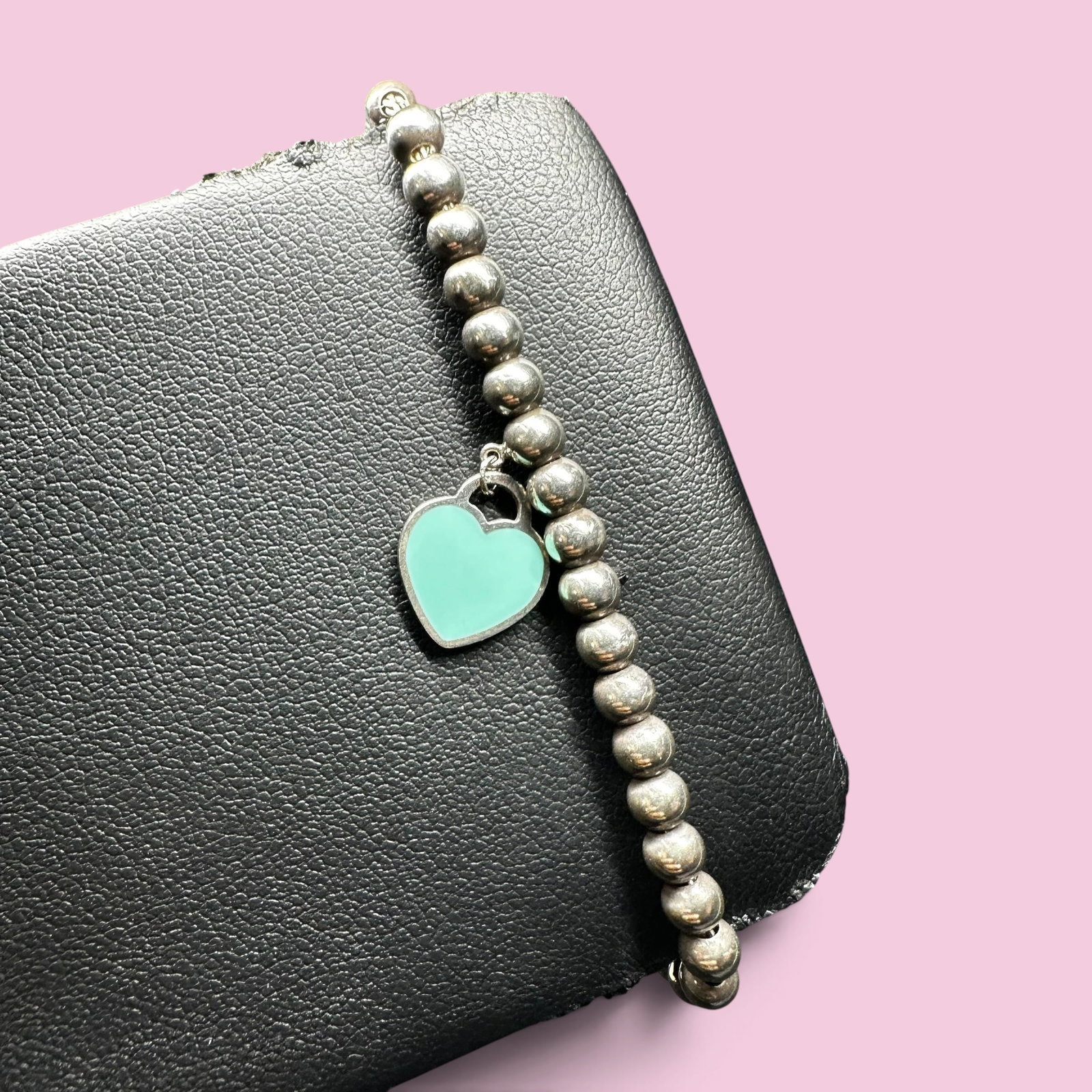 6.25"/6g Tiffany & Co. Sterling Silver Enamel Heart Bracelet: 6.25"/6g Tiffany & Co. Sterling Silver Enamel Heart Bracelet"Brand/Model: Tiffany & Co. “Return to Tiffany” Enamel Heart Tag Bead Bracelet. Hallmarked “© TIFFANY & CO.” and “AG925.&