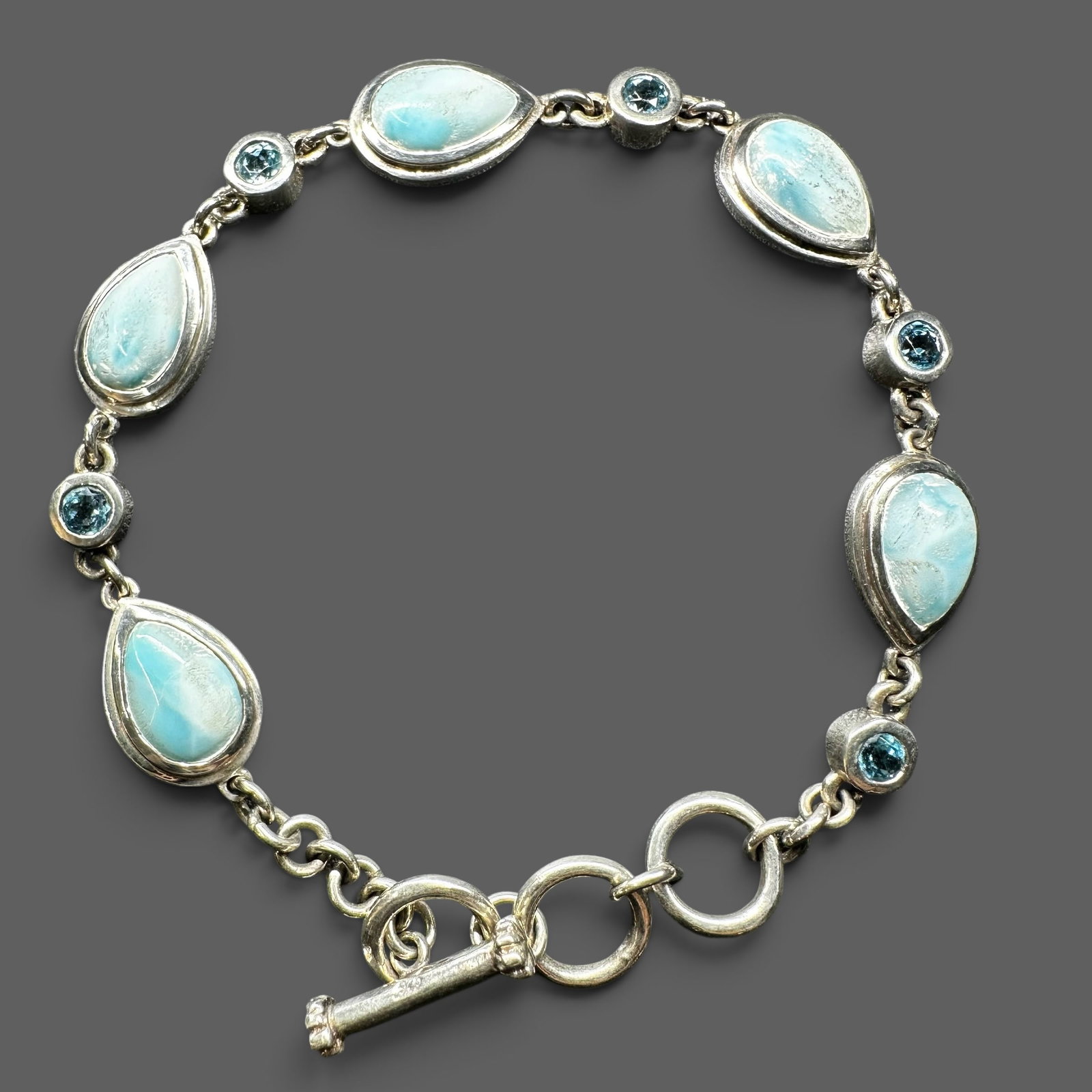 8”/22g 925 Sterling Silver Larimar Blue Topaz Bracelet: 8”/22g 925 Sterling Silver Larimar Blue Topaz Bracelet:Brand/Model: No hallmark. Unidentified artisan/shop.Manufacturer Location: Not marked.Year Produced: Unknown.Specs/Description: 925 Sterlin
