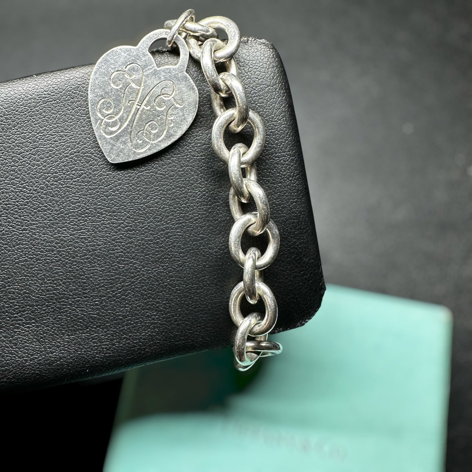 6.75”/35g Tiffany & Co. 925 Sterling Silver Engraved Heart Charm Bracelet: 6.75”/35g Tiffany & Co. 925 Sterling Silver Engraved Heart Charm Bracelet:Brand/Model: Tiffany & Co. Heart Tag Charm Bracelet.Manufacturer Location: Tiffany & Co., New York, New York.Year Produc