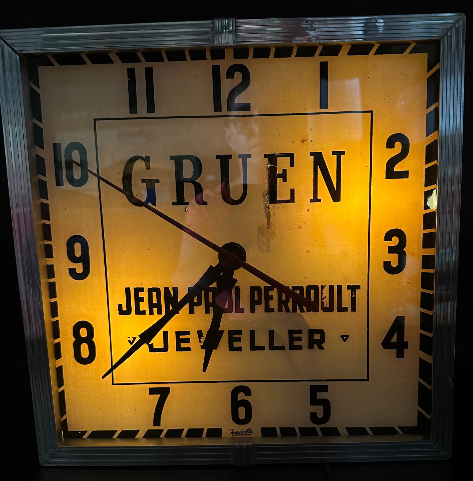 Vintage Gruen Jewelers Lighted Advertising Clock – Forestville: Vintage Gruen jewelry store advertising wall clock manufactured by Forestville Clock Co., Toronto, Canada. Large square Art Deco/Streamline-style case with illuminated dial, bold numerals and advertis