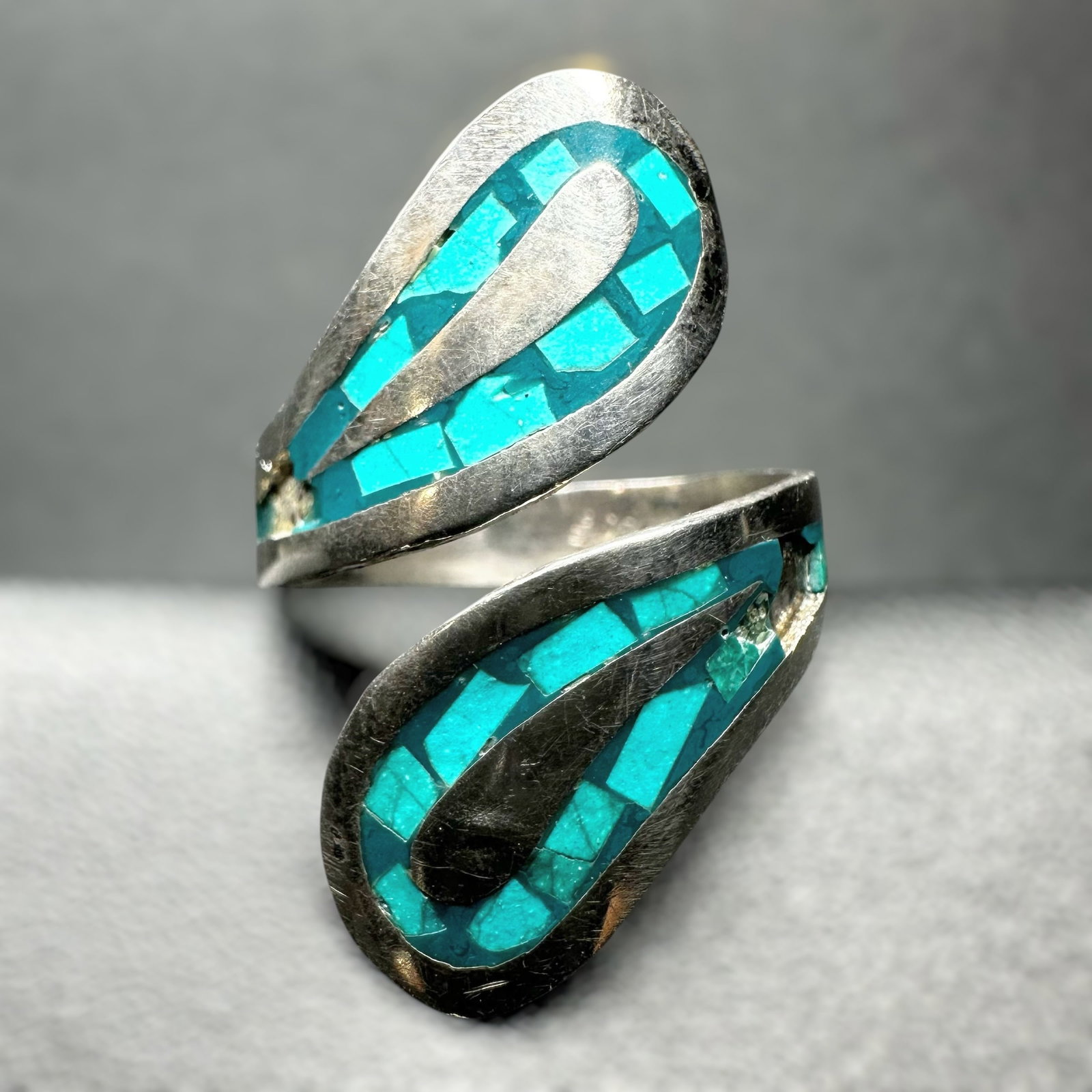 Sz8/3g Mexico Sterling Silver Turquoise Inlay Bypass Ring: Sz8/3g Mexico Sterling Silver Turquoise Inlay Bypass RingBrand/Model: Hallmarked with Mexican Eagle #1 assay mark.Manufacturer Location: Mexico City, Mexico.Year Produced: 1950s-1960s.Specs/Descriptio