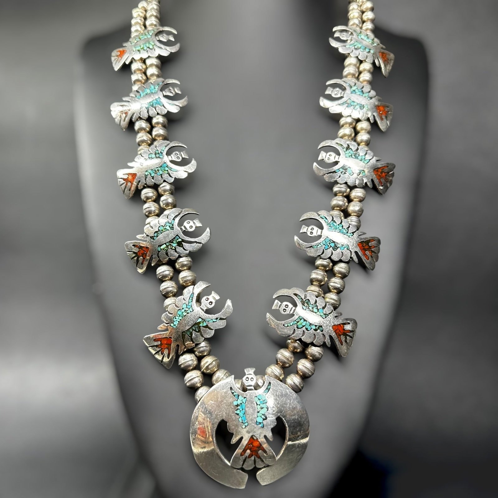 25"/168g Navajo (Diné Sterling Silver Turquoise Coral Chip Inlay Kachina Squash Blossom: 25"/168g Navajo (Diné) Sterling Silver Turquoise Coral Chip Inlay Kachina Squash Blossom Necklace:Brand/Model: No hallmark. Unidentified artisan/shop.Manufacturer Location: Not marked.Year Produced: 