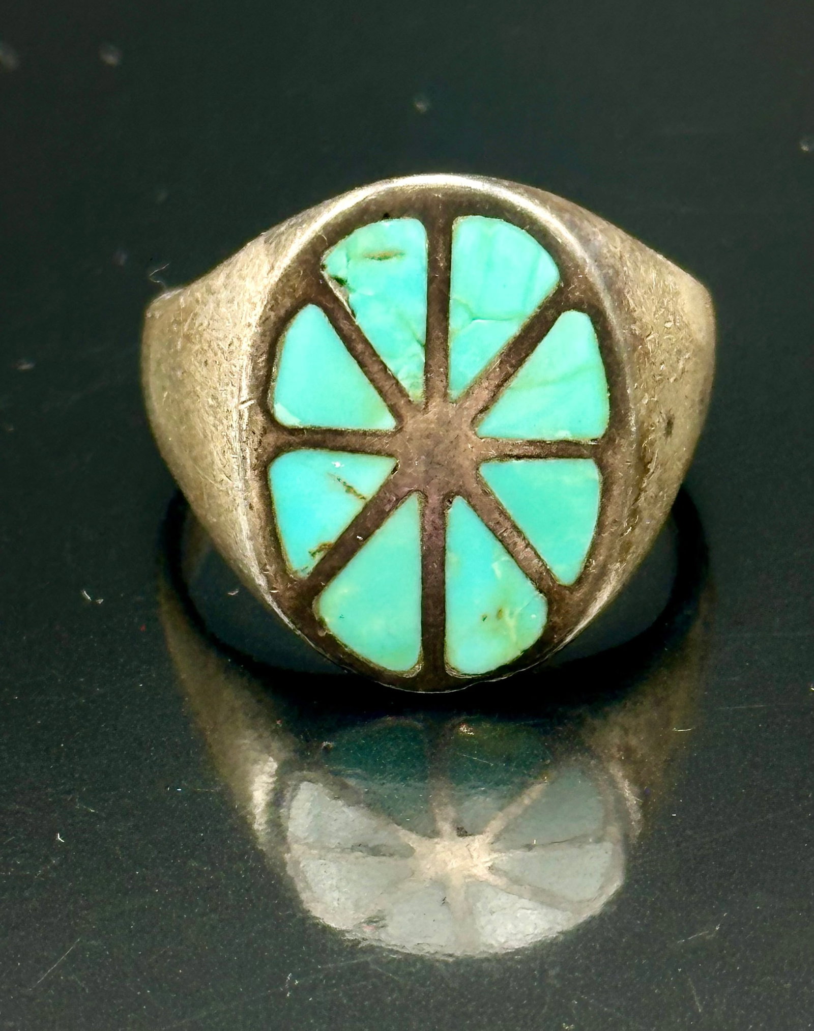 11g Vintage Sterling Silver Turquoise Sunburst Inlay Ring: Vintage Southwestern sterling silver ring with segmented turquoise inlay in a round sunburst design. Unsigned. Some turquoise pieces have cracks and small chips. Shows silver patina and vintage wear. 