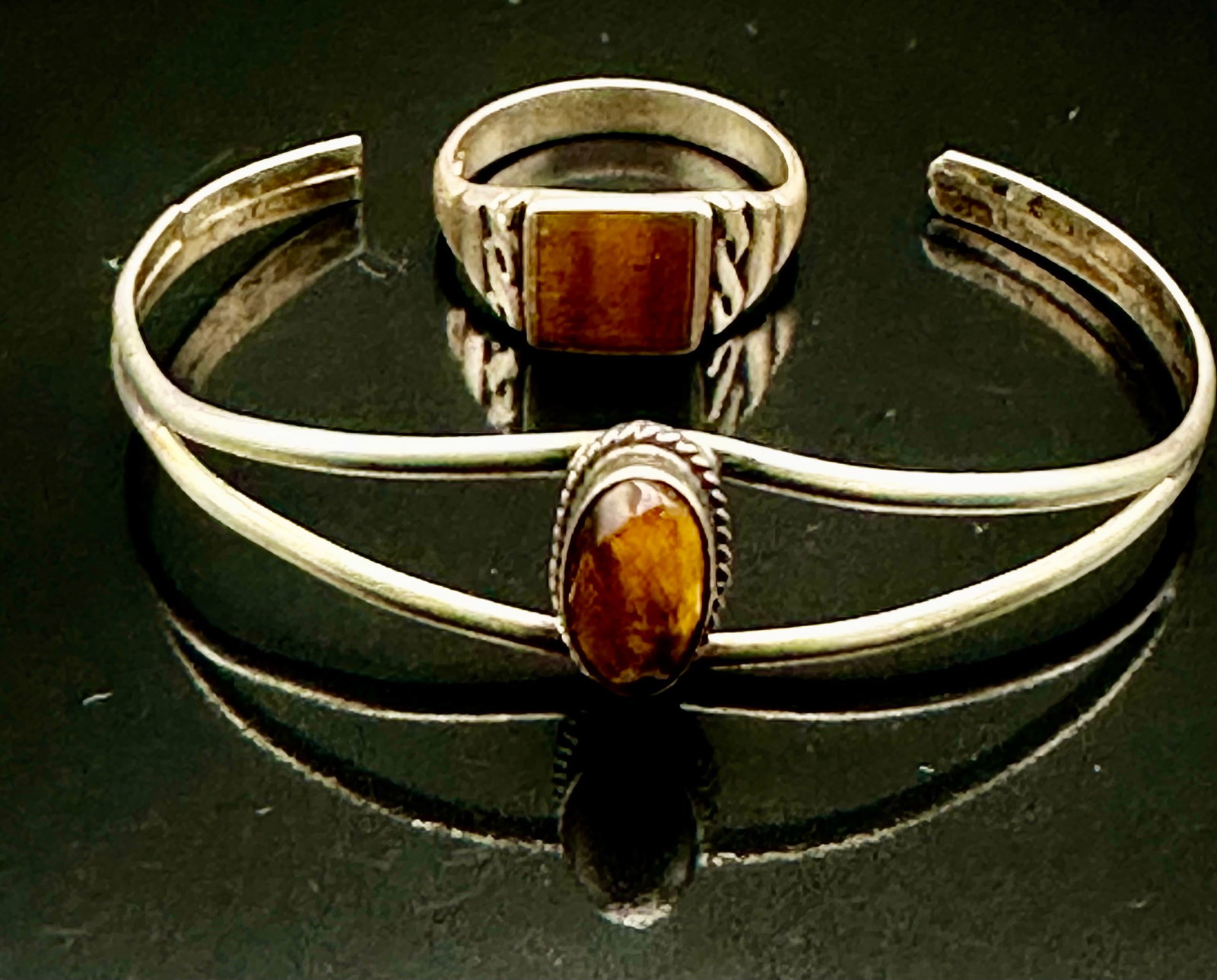 Vintage Tiger’s Eye Sterling Silver Cuff Bracelet & Ring Set 8g: Vintage sterling silver cuff bracelet and ring set with brown tiger’s eye stones. Double-band bracelet and square stone ring. Normal vintage wear and tarnish. No artist hallmark visible. Total weigh