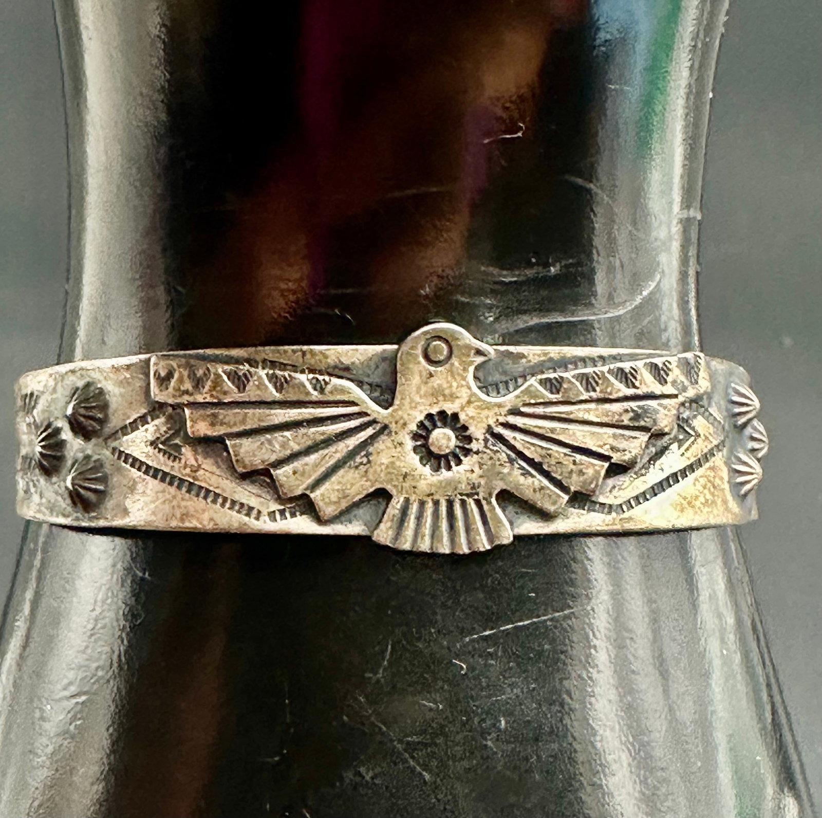 15g Old Fred Harvey Era Navajo Thunderbird Sterling Silver Cuff Bracelet: Old Fred Harvey era Navajo sterling silver cuff bracelet, circa 1930s–1940s. Features an applied thunderbird with traditional hand-stamped designs and a nice aged patina. Unsigned.