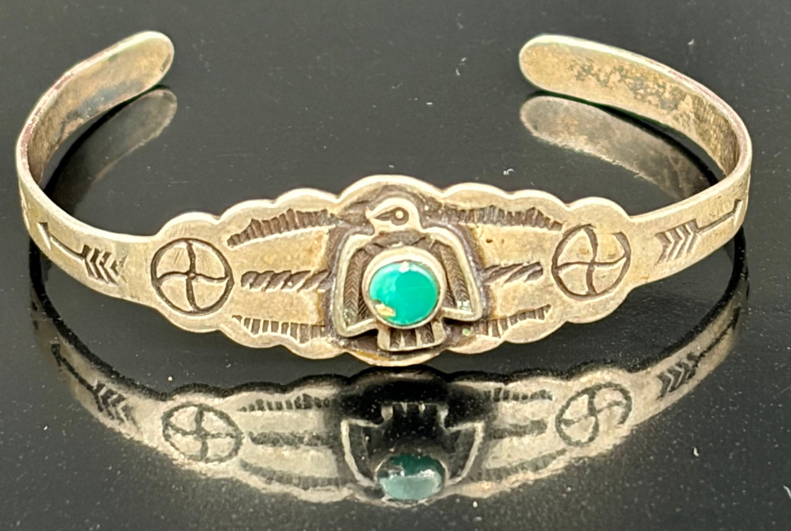 5.6 g Sterling Silver Turquoise Fred Harvey Era Baby Bracelet: Vtg super nice Fred Harvey Era sterling silver small cuff bracelet with small turquoise Thunderbird in really great condition!! It has many sharp clear stampings and the small Thunderbird has a center