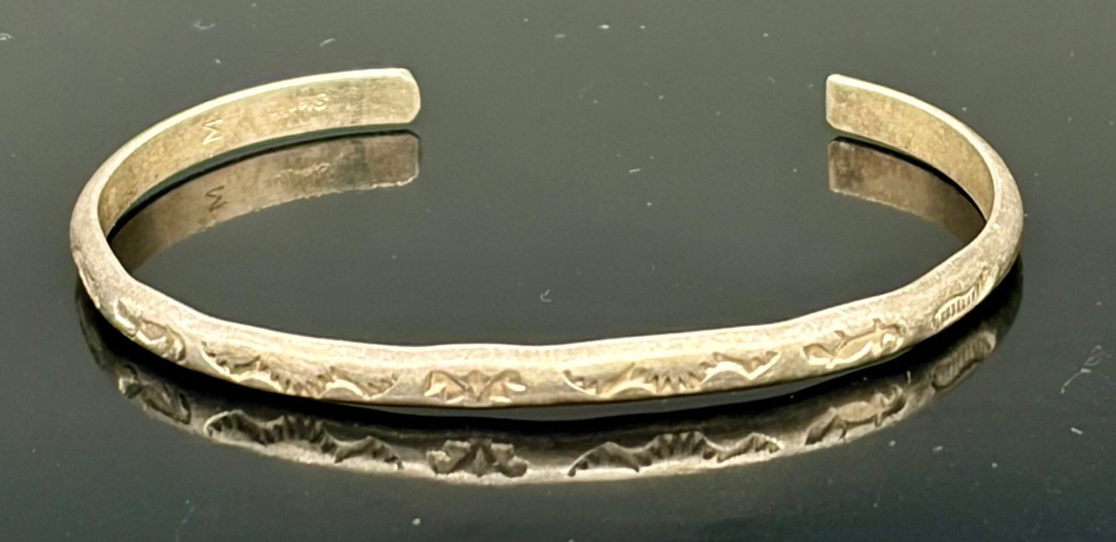 8.2 g Handmade Native American Navajo Plain stamped Sterling Silver stamped Cuff Bracelet: This elegant vintage sterling silver cuff bracelet highlights the artistry of traditional Southwestern hand-stamped metalwork. Crafted from a slender, solid silver band, the exterior is meticulously d
