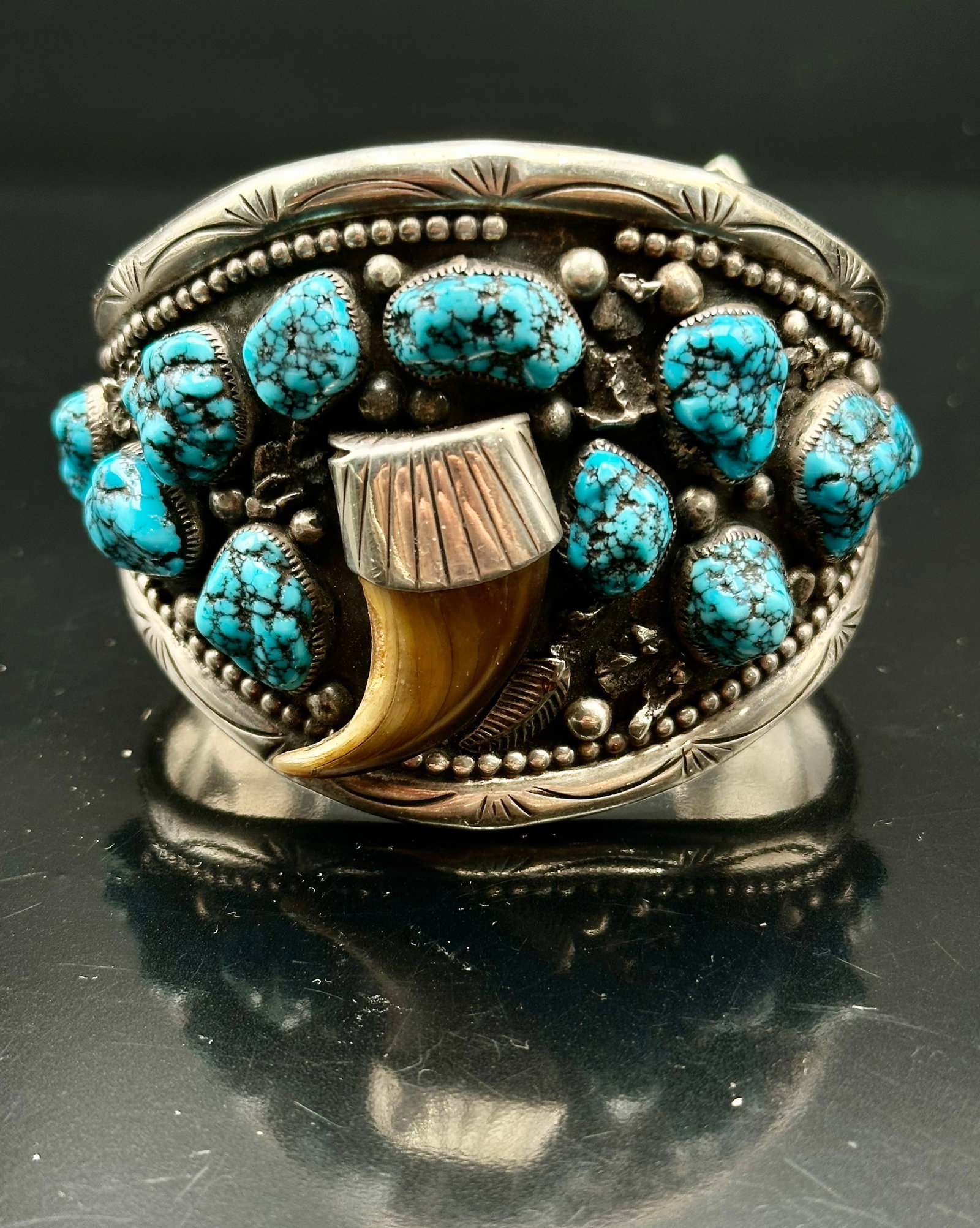 96g Erma Francis Navajo Turquoise Claw Sterling Silver Cuff Bracelet: Large handmade Navajo sterling silver cuff by Erma Francis. Set with 11 spiderweb turquoise stones and a claw centerpiece with heavy silver work and stamped edges. Signed “E. FRANCIS” inside. 